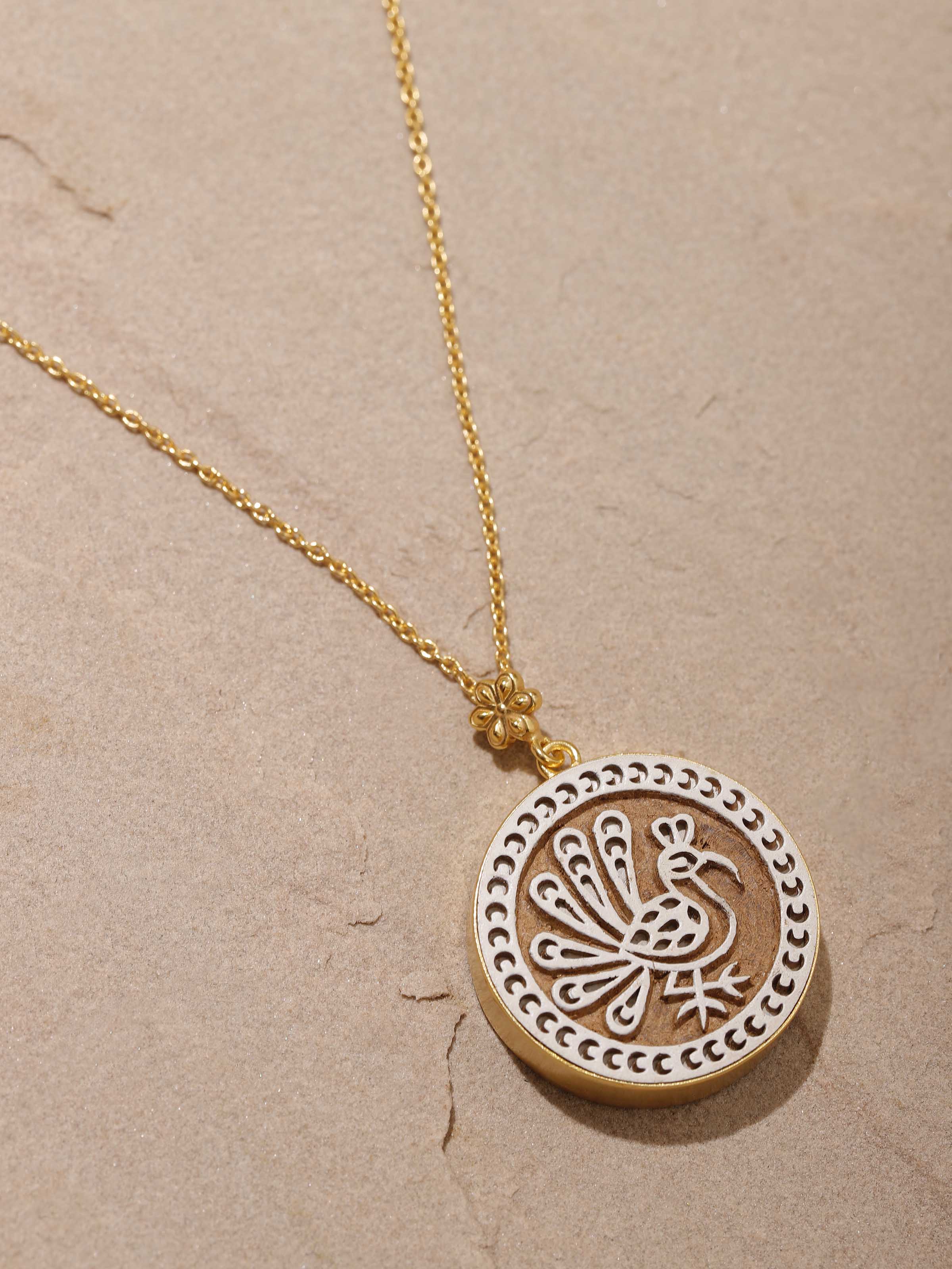 Detailed view of Teakwood Pendant and Chain highlighting the wood's grain and the chain's design
