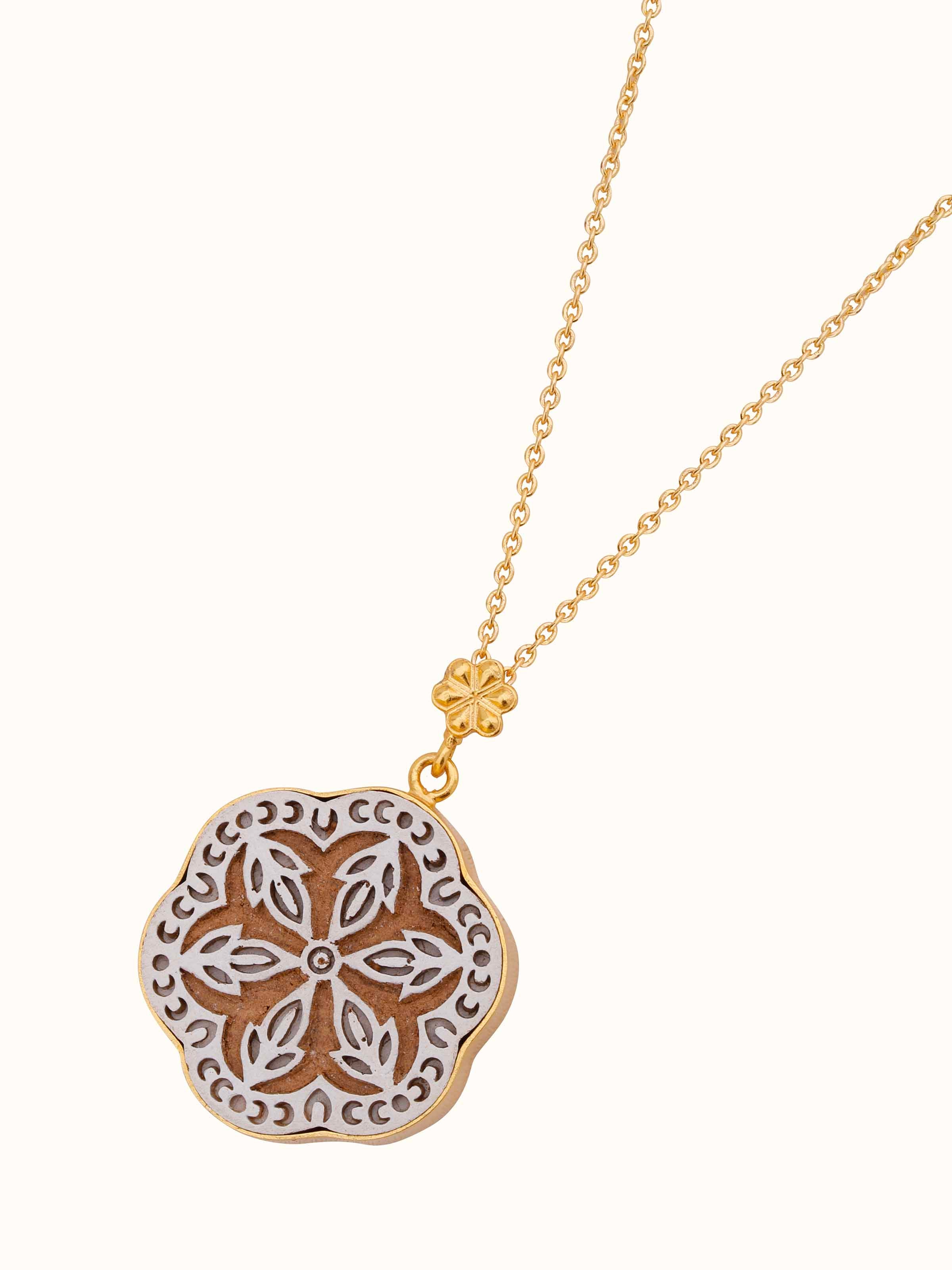 Angled view of Teakwood Pendant and Chain highlighting the pendant's intricate shape and chain's drape