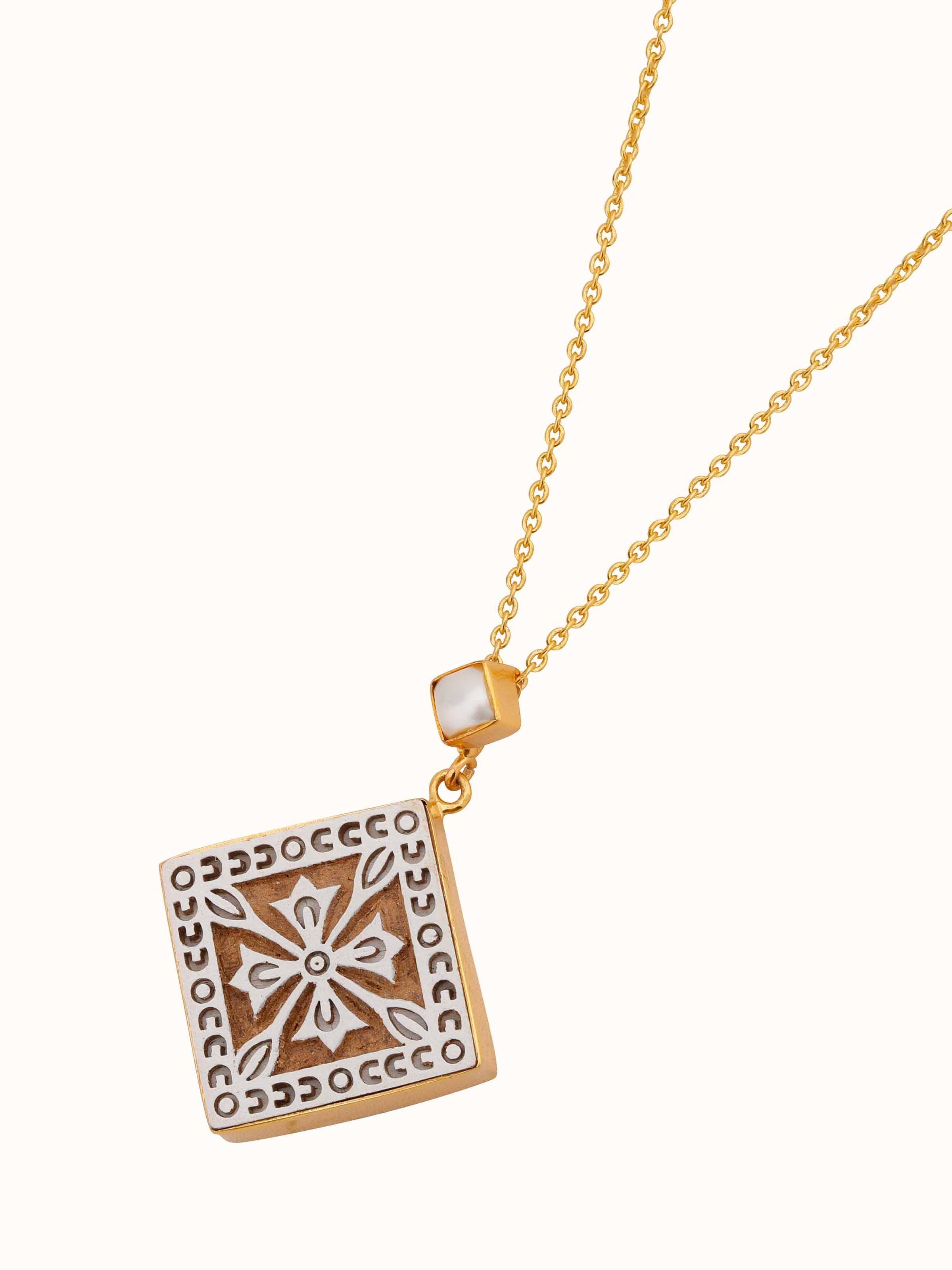 Angled view of Teakwood Pendant & Chain showcasing the pendant's design and chain’s elegant drape