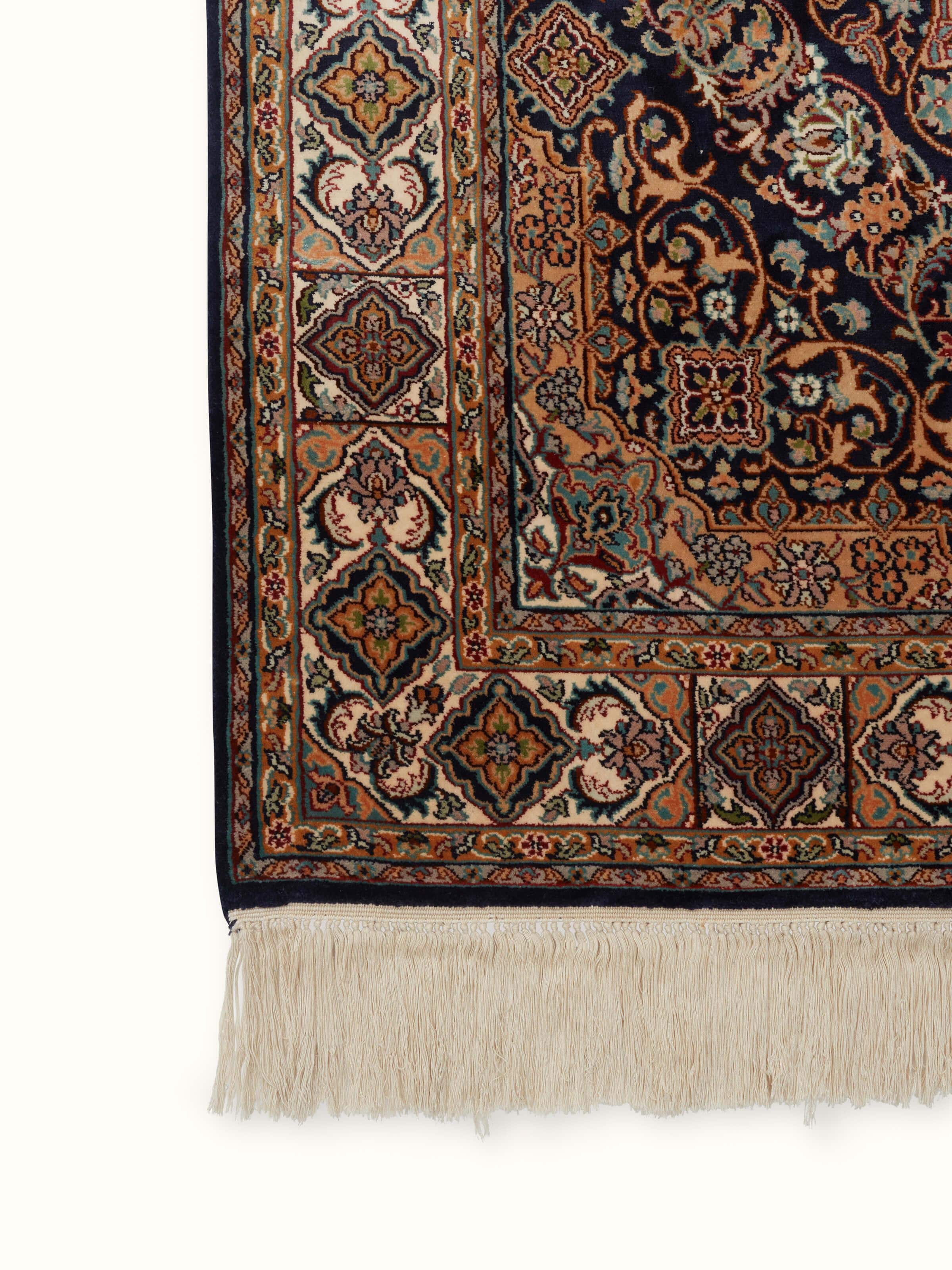 Close-up of Traditional Persian Sadakdar Kashmir silk hand-knotted carpet highlighting the detailed craftsmanship and texture