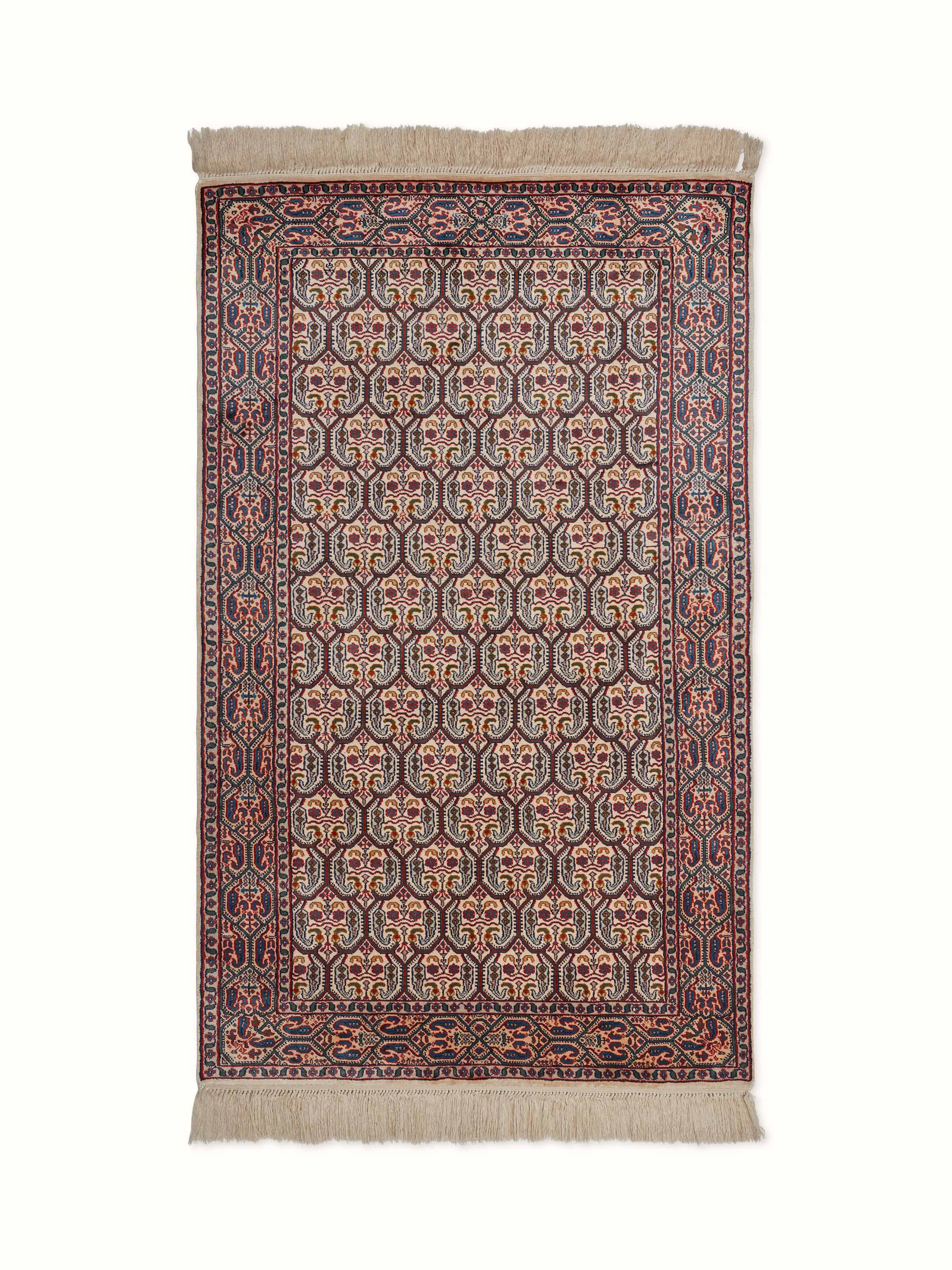 Front view of a traditional Persian hand-knotted silk carpet from Kashmir, highlighting intricate Senna patterns and rich colors.