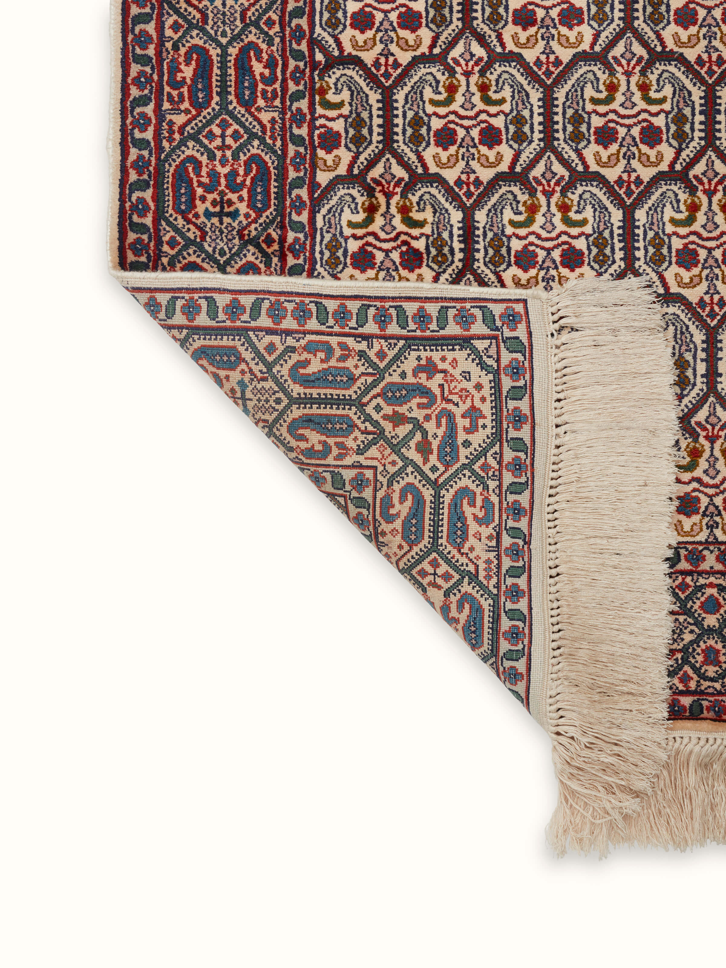 Back view of a Persian hand-knotted silk carpet from Kashmir, showing the tightly woven knots and quality construction.