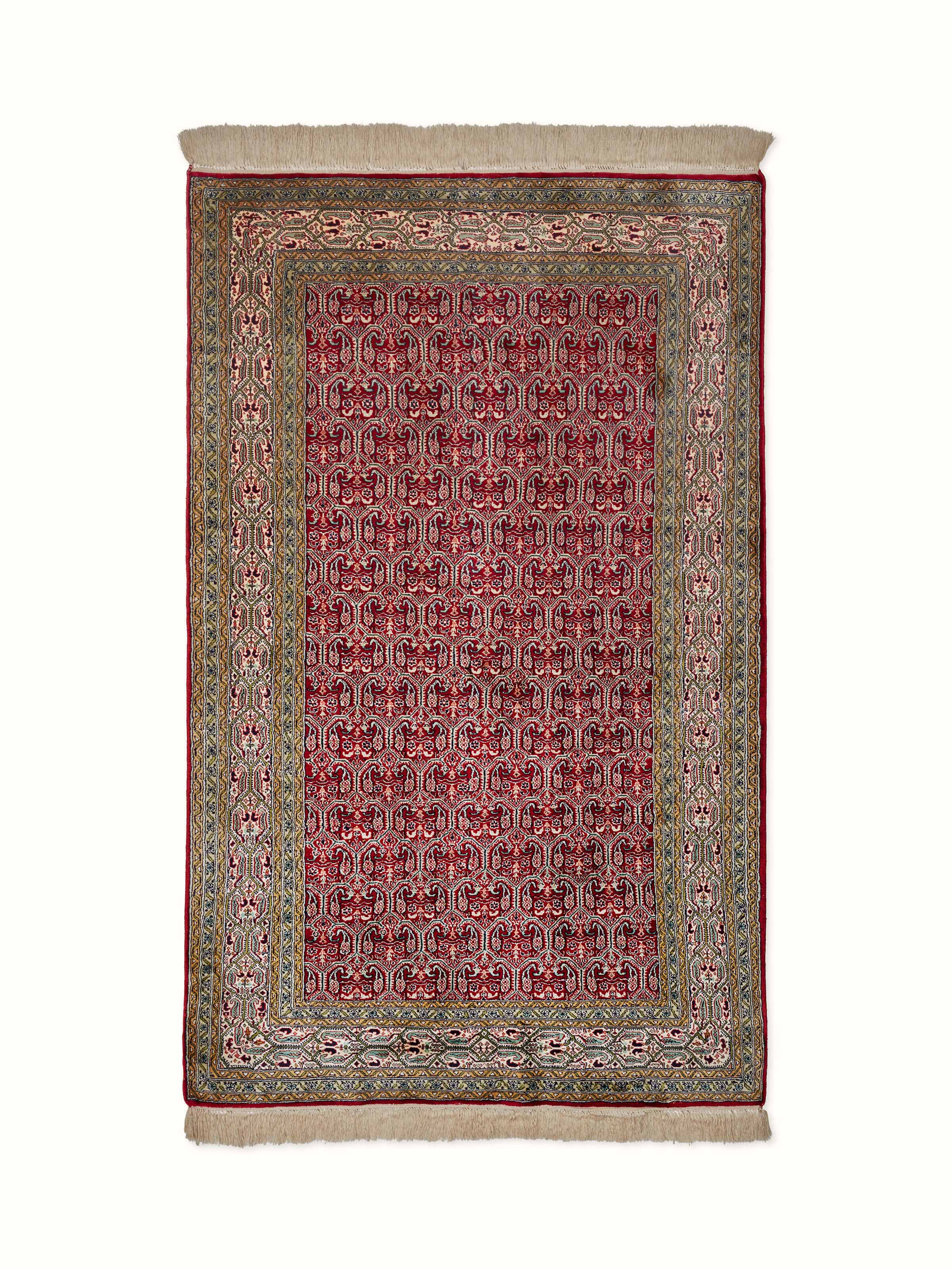 Close-up view of Traditional Persian Red Senna Kashmir Silk Hand-Knotted Carpet highlighting intricate patterns and rich red color.