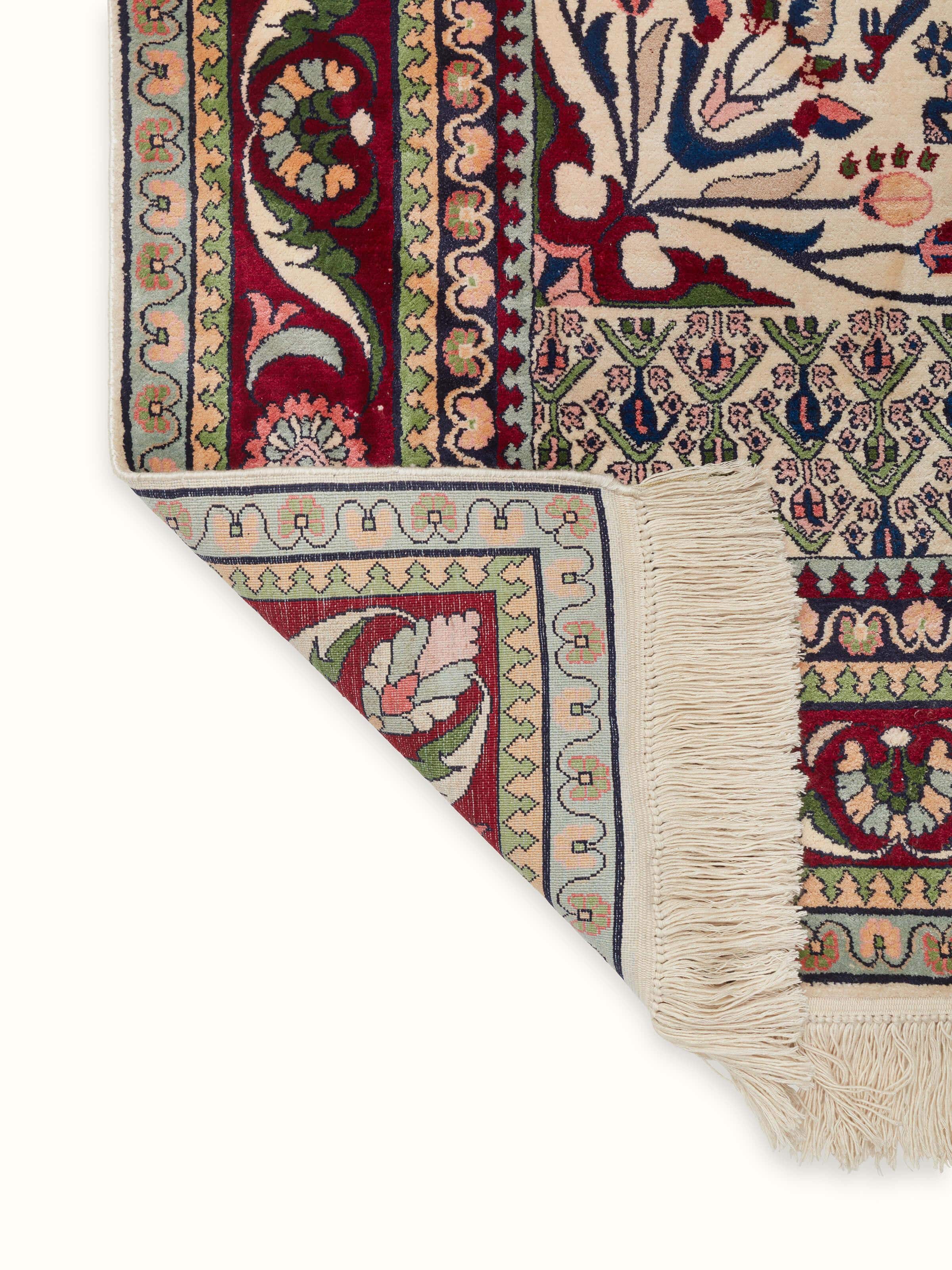Back view of Traditional Persian Isfahan Kashmir silk hand-knotted carpet showcasing fine weaving patterns