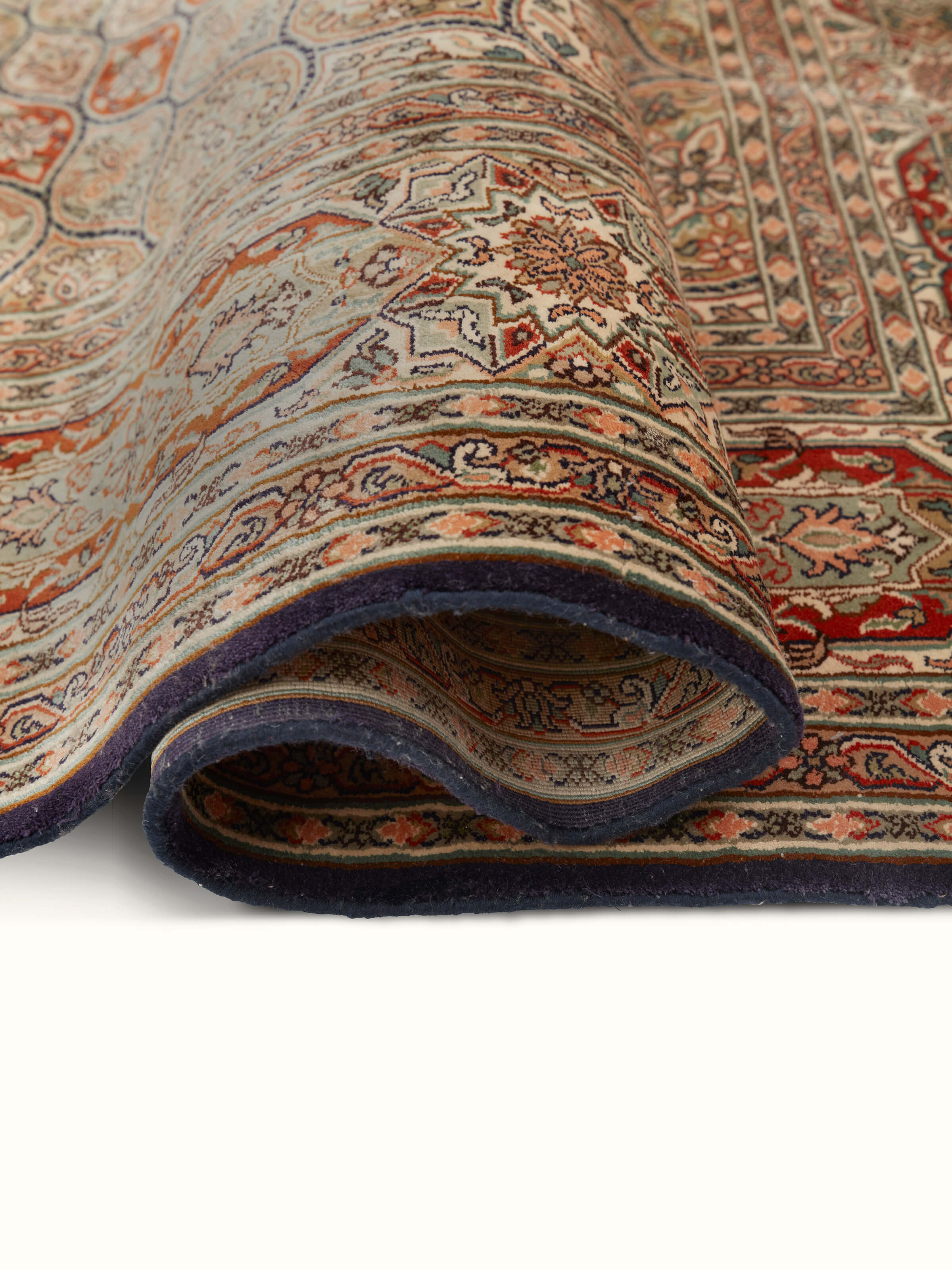 Traditional Persian rust gumbad Kashmir silk hand-knotted carpet displayed in a room setting, showing its design and size in use.