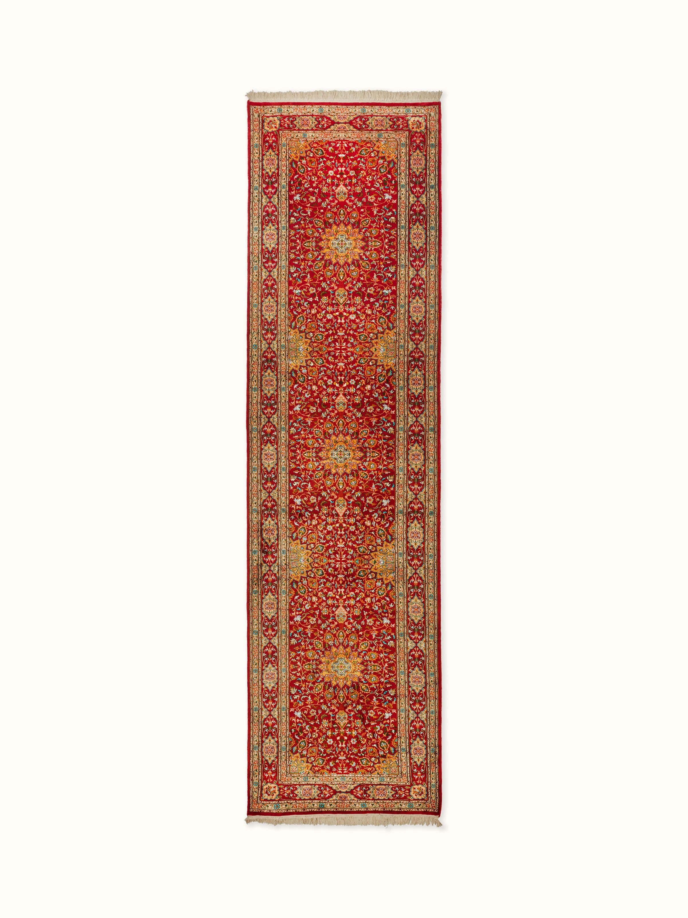 Traditional Persian red Kashan Kashmir silk hand-knotted runner with intricate patterns and rich red hues.