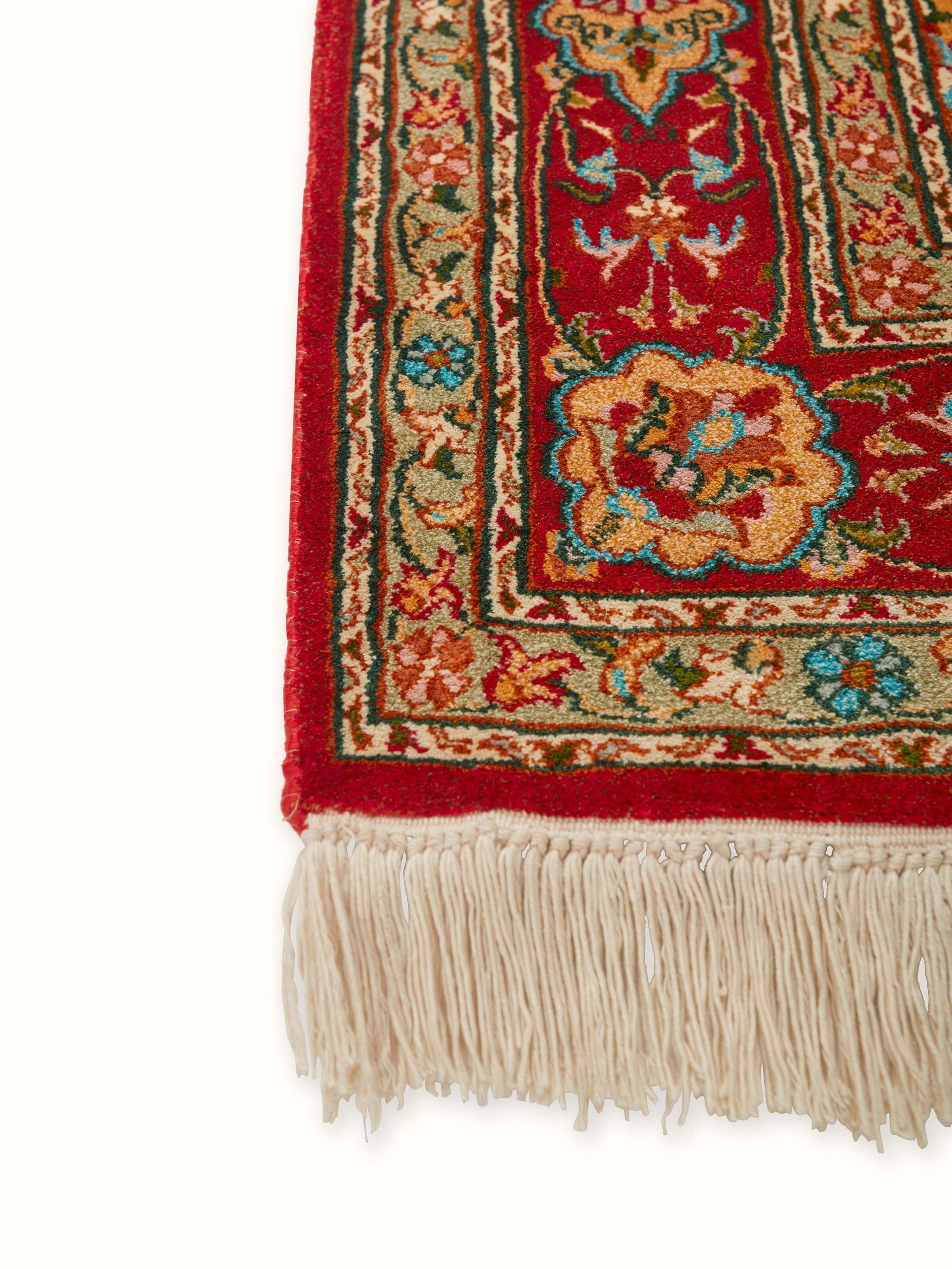 Close-up view of Traditional Persian red Kashan Kashmir silk hand-knotted runner showcasing the detailed craftsmanship and silk texture.