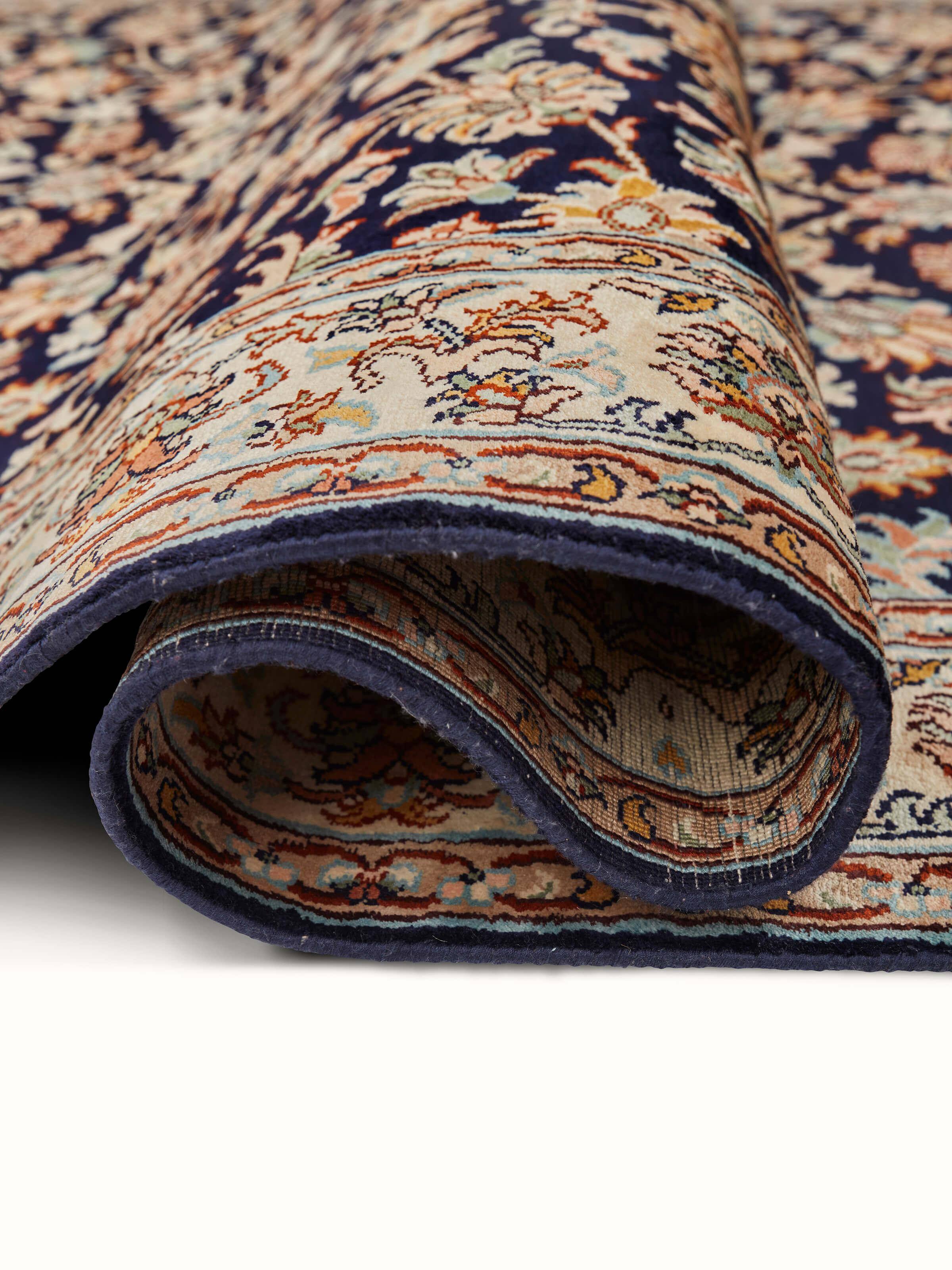 Traditional Persian navy allover Kashmir silk hand-knotted runner draped to show its full length and elegant design.