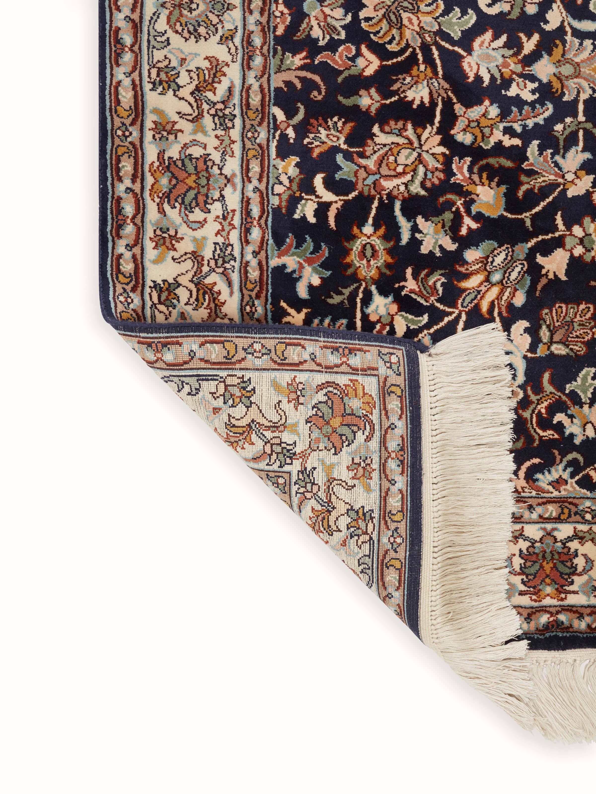 Folded Traditional Persian navy allover Kashmir silk hand-knotted runner showcasing the fabric's sheen and pattern.