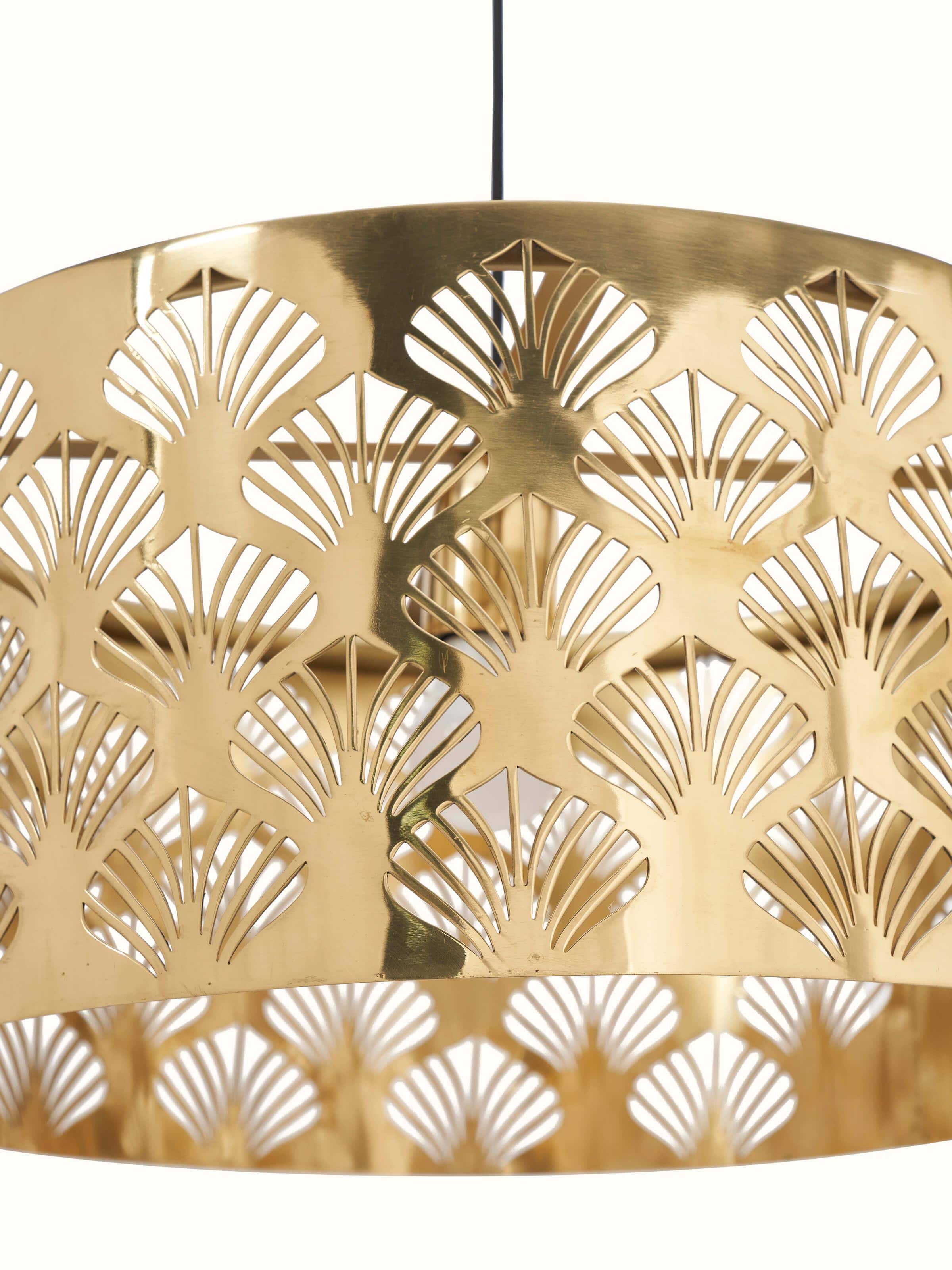 Close-up of Nakash Brass Pendant Light focusing on the intricate brass detailing and unique design.