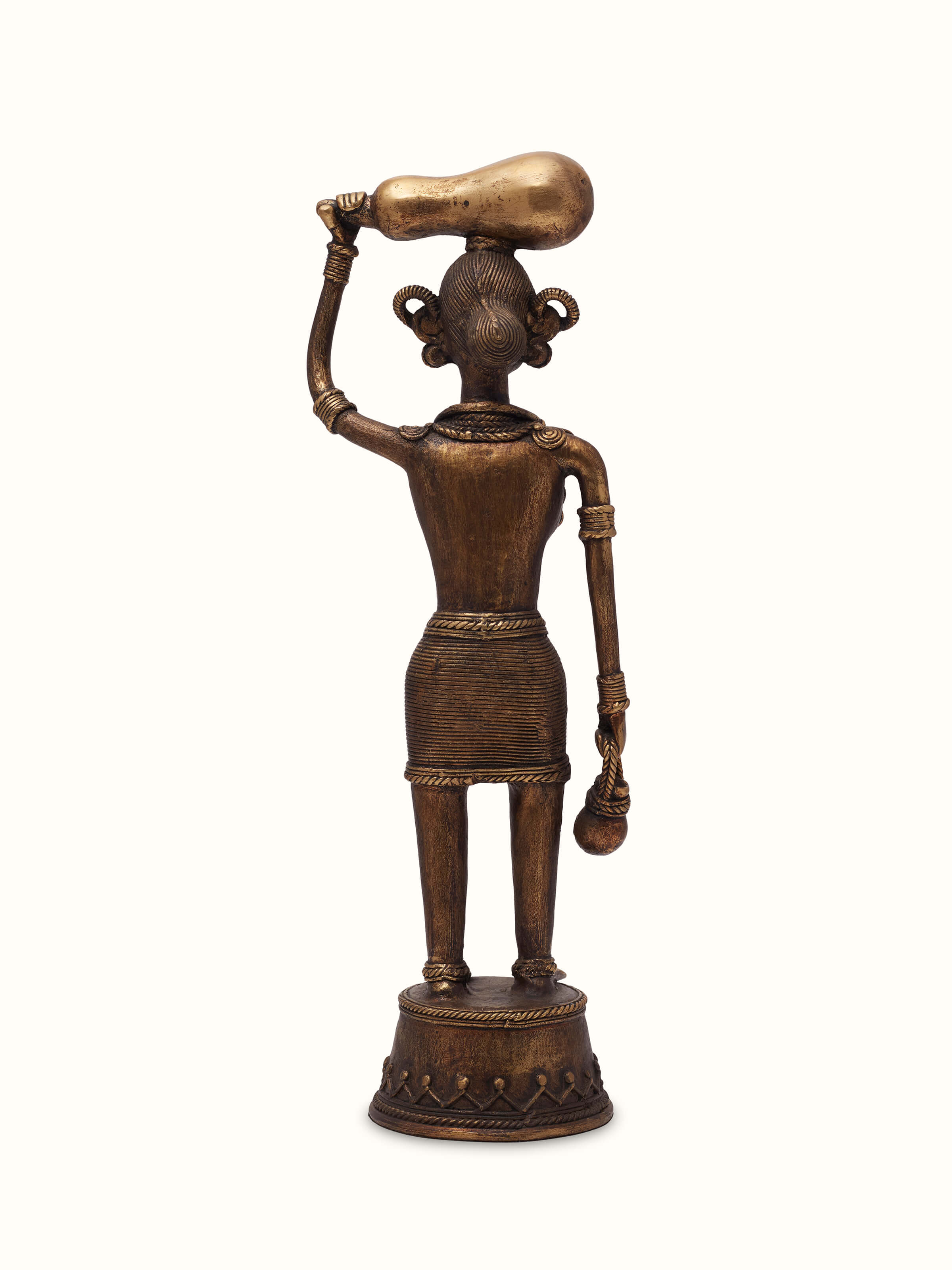 Rear view of Dhokra Brass Tribal Woman Figurine, capturing the detailed craftsmanship and design of the tribal woman figure in brass.