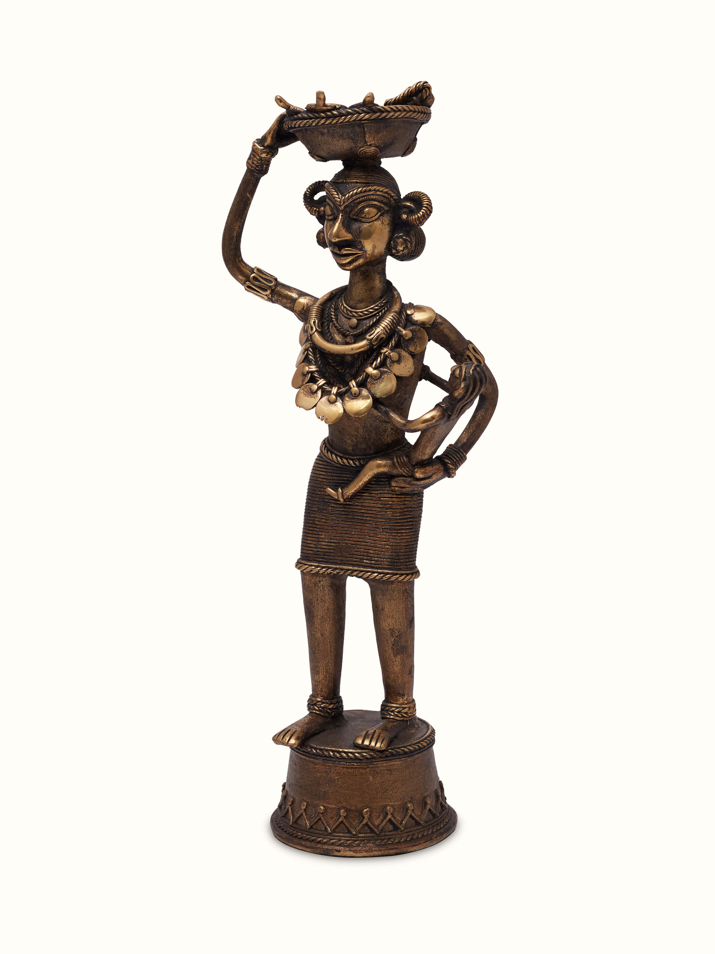 Side view of Dhokra Brass Tribal Mother Artpiece, showcasing the intricate brass work and tribal design.