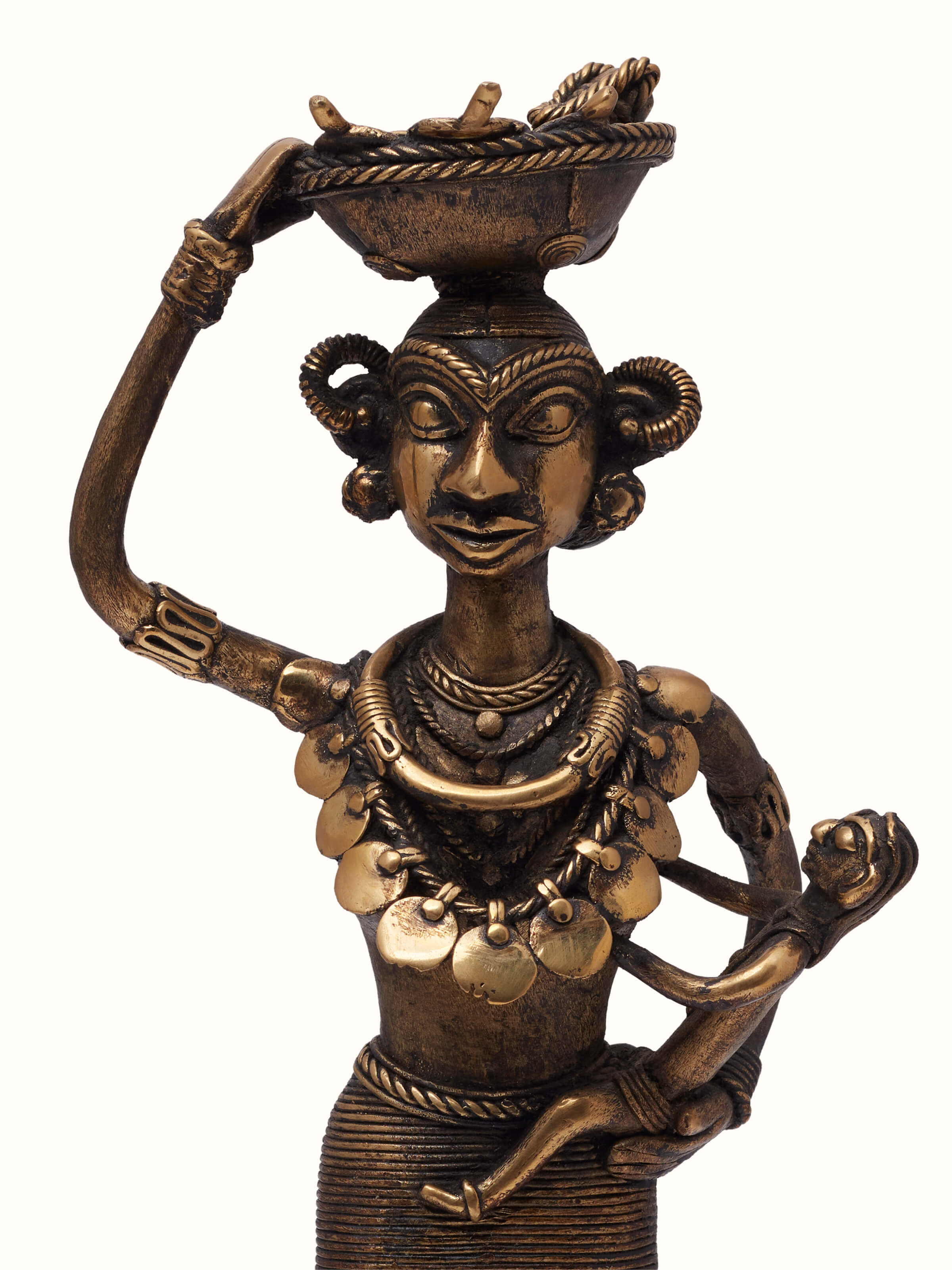 Close-up view of Dhokra Brass Tribal Mother Artpiece, highlighting the fine detailing and the natural texture of the brass.