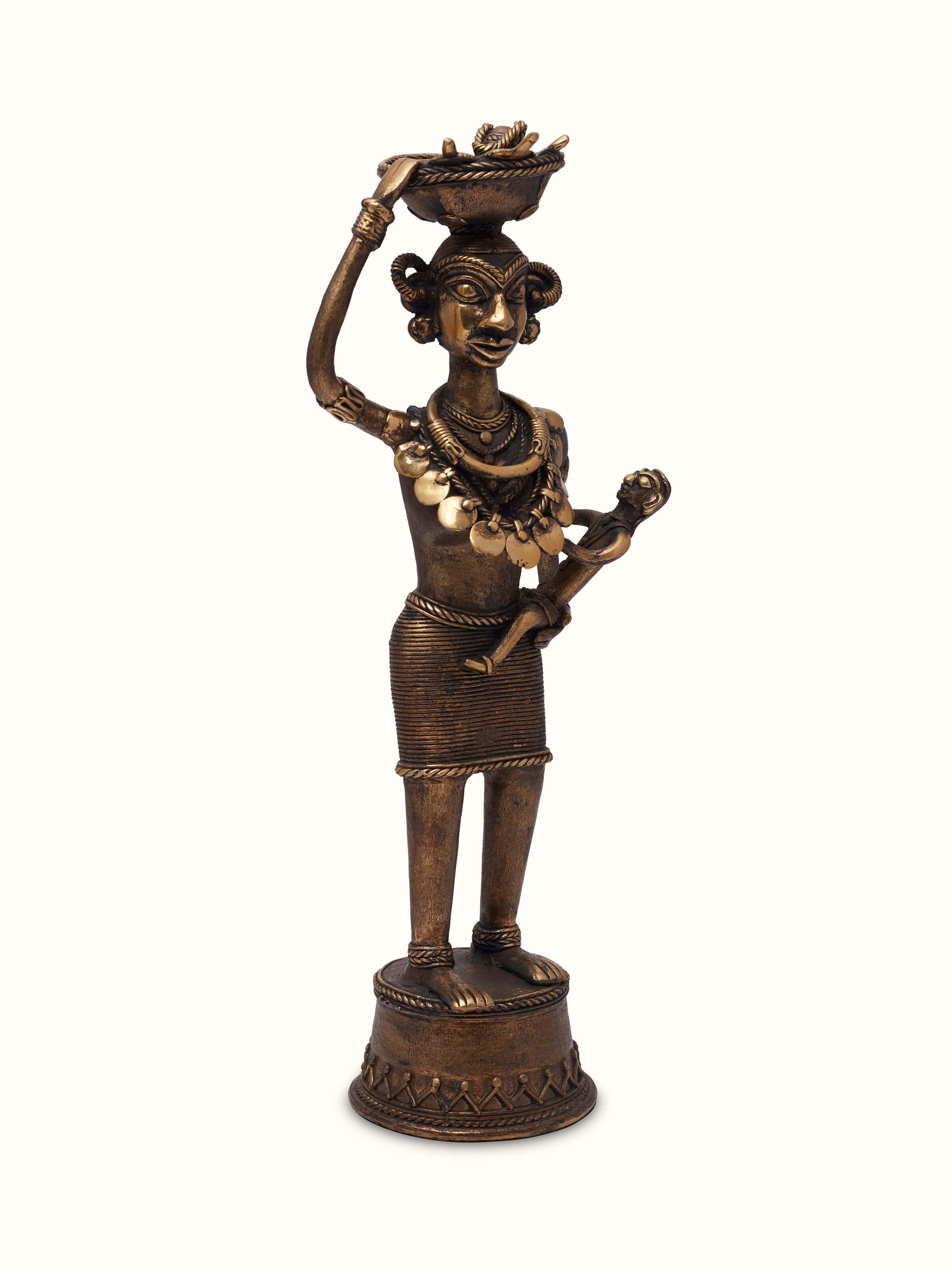 Angled view of Dhokra Brass Tribal Mother Artpiece, displaying the tribal mother figure and detailed brass craftsmanship.