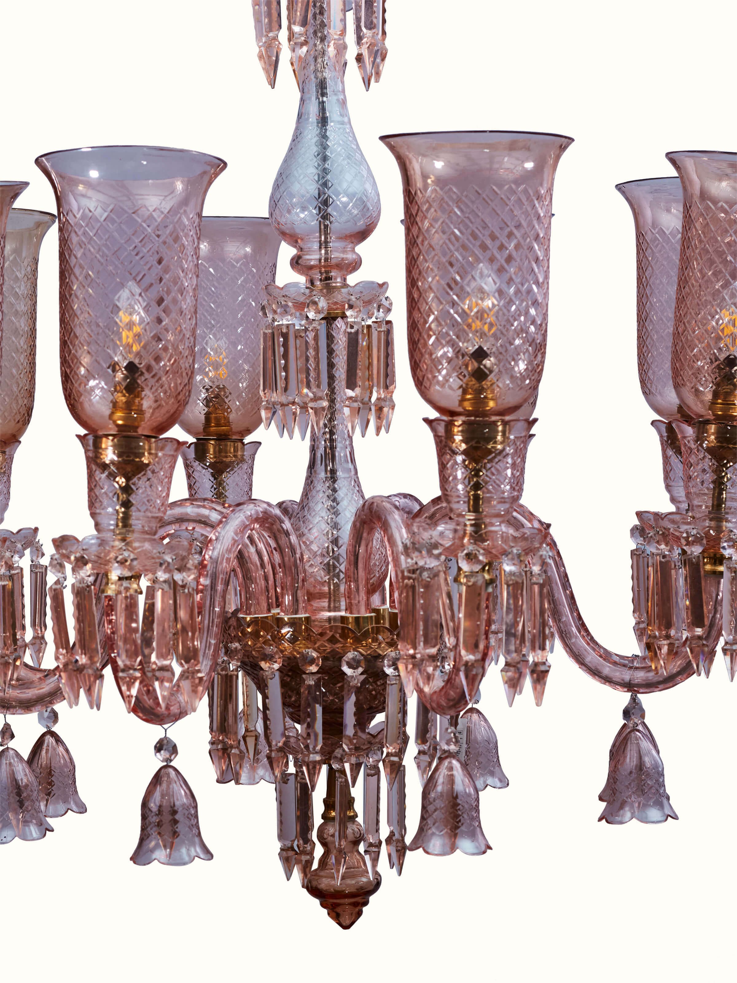 Close-up of Pink Glass Chandelier focusing on the details of the pink glass and metal fittings.