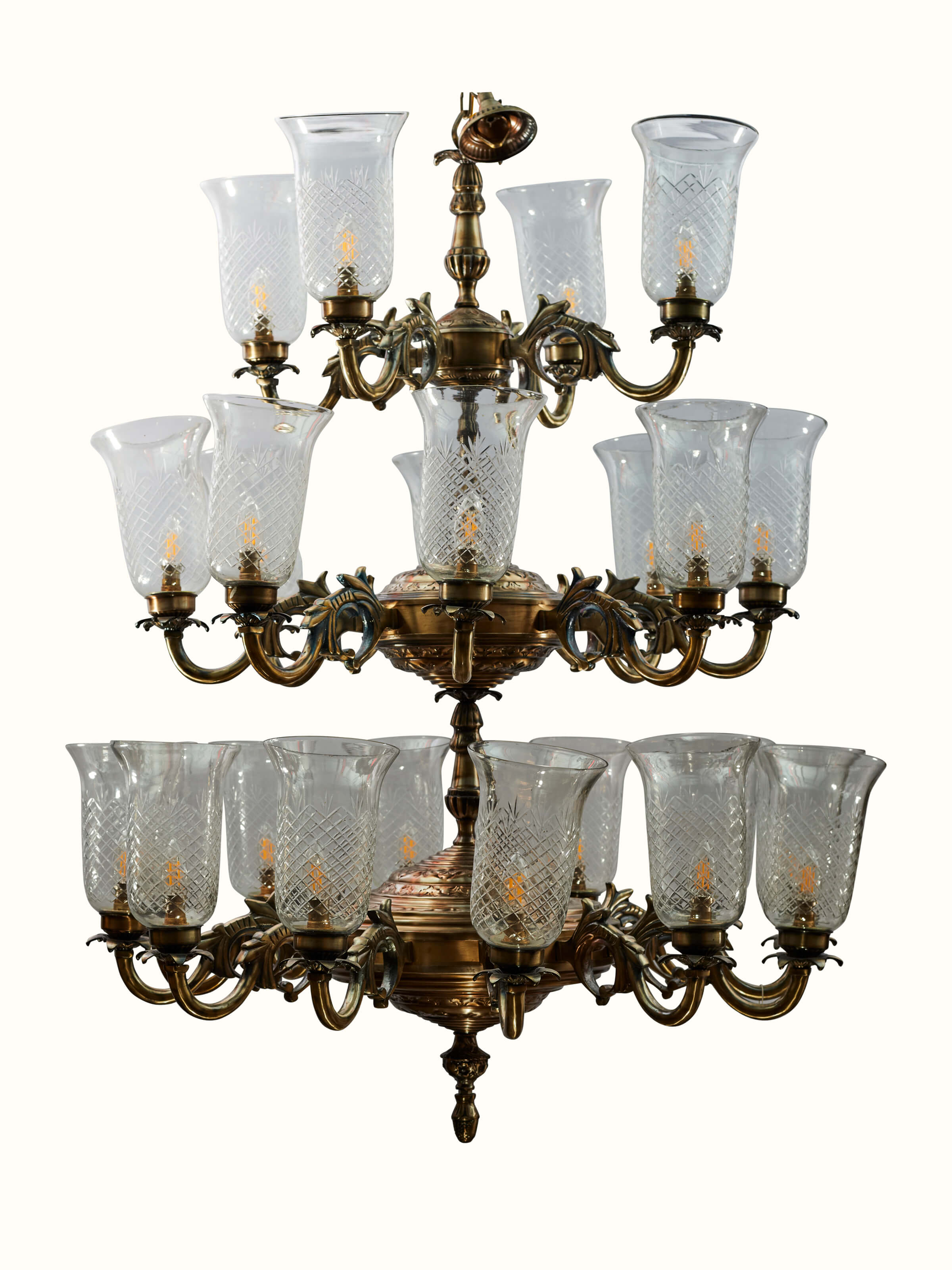 Front view of Glass Work Brass Chandelier showcasing its brass detailing and glass elements.