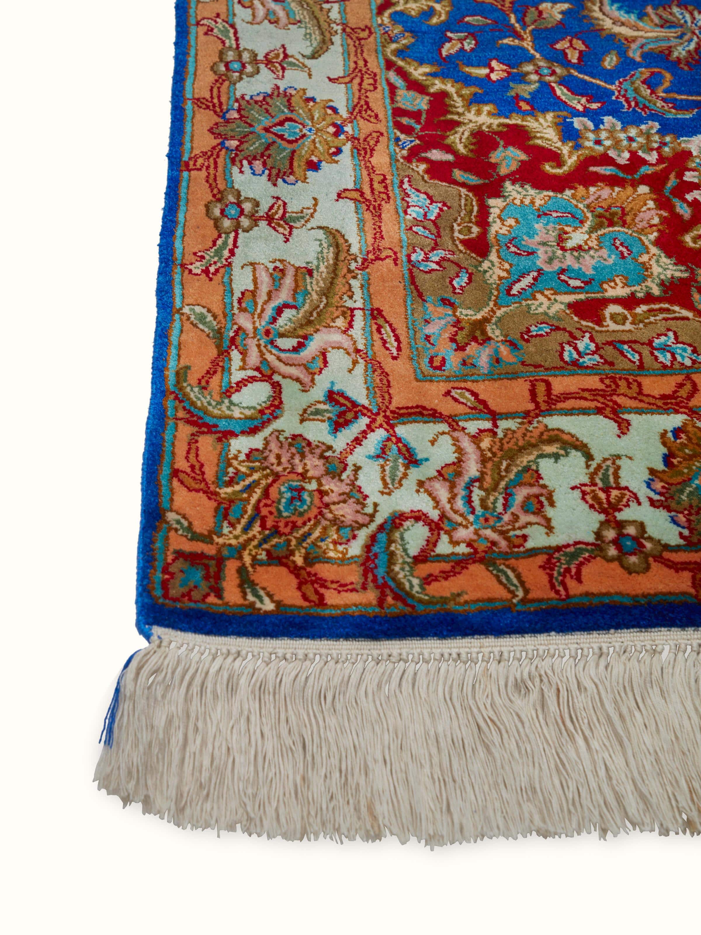 Detailed close-up of Traditional Persian Blue Red Kashan Kashmir silk hand-knotted carpet, highlighting the silk texture and design details.