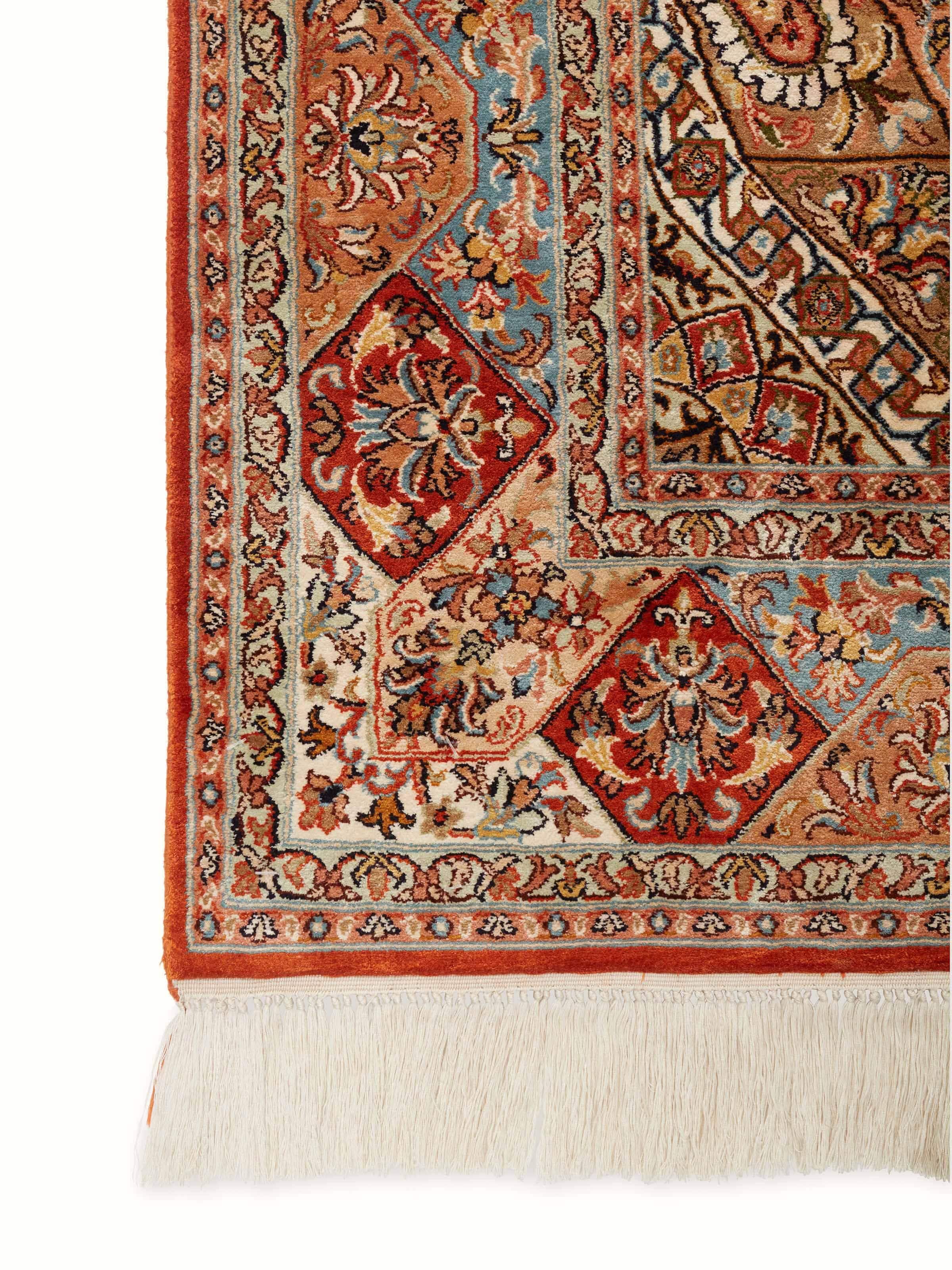 Detailed view of Traditional Persian rust khatamband Kashmir silk hand-knotted carpet showcasing its complex design