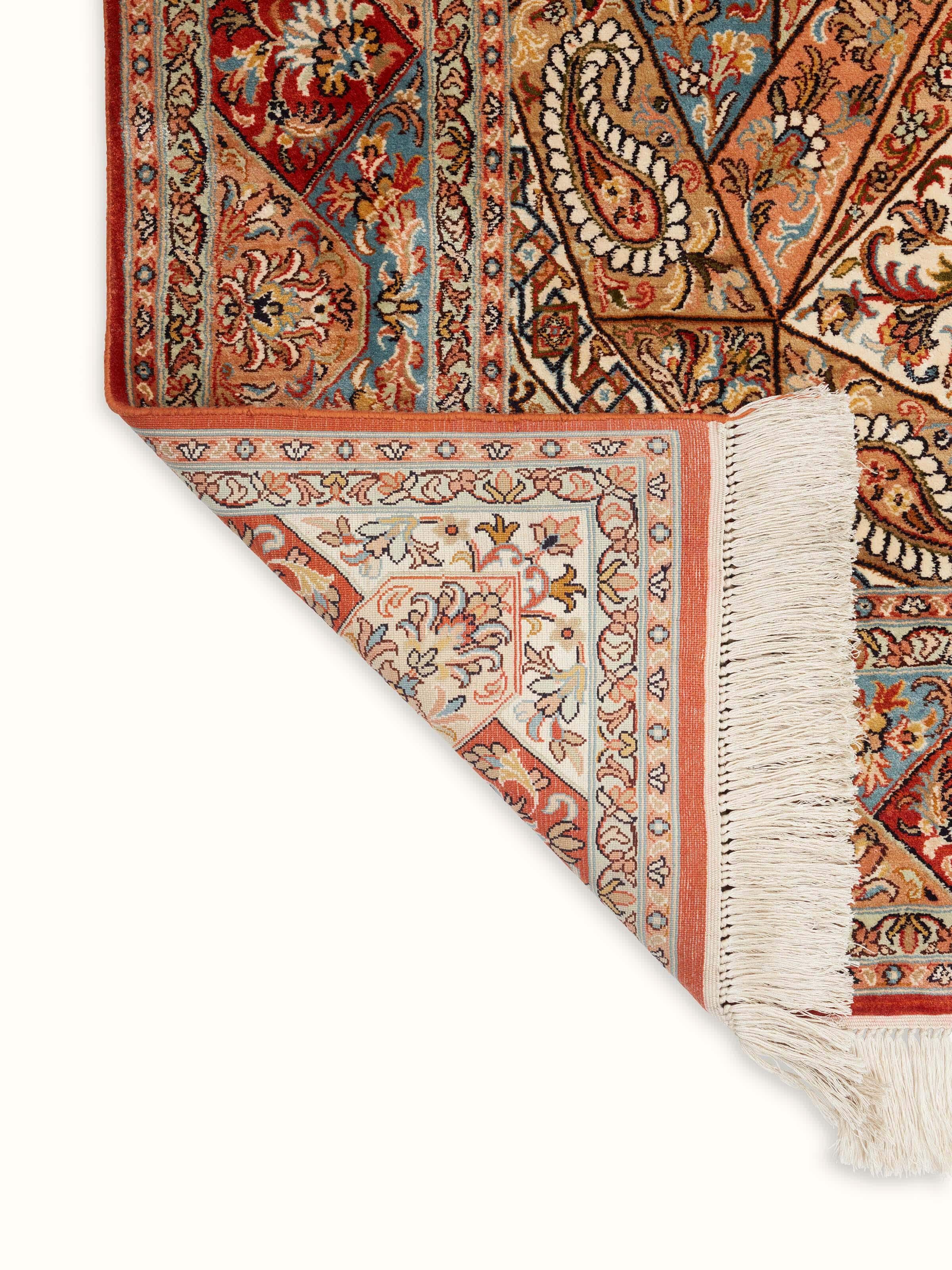 Front view of Traditional Persian rust khatamband Kashmir silk hand-knotted carpet illustrating its full pattern and rich color