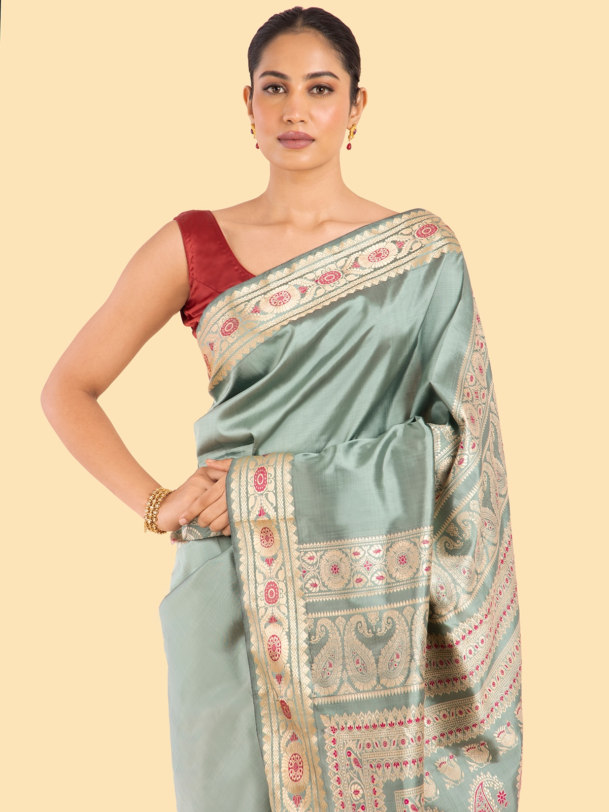 Angle view of Sage green mulberry silk Baluchari saree highlighting design