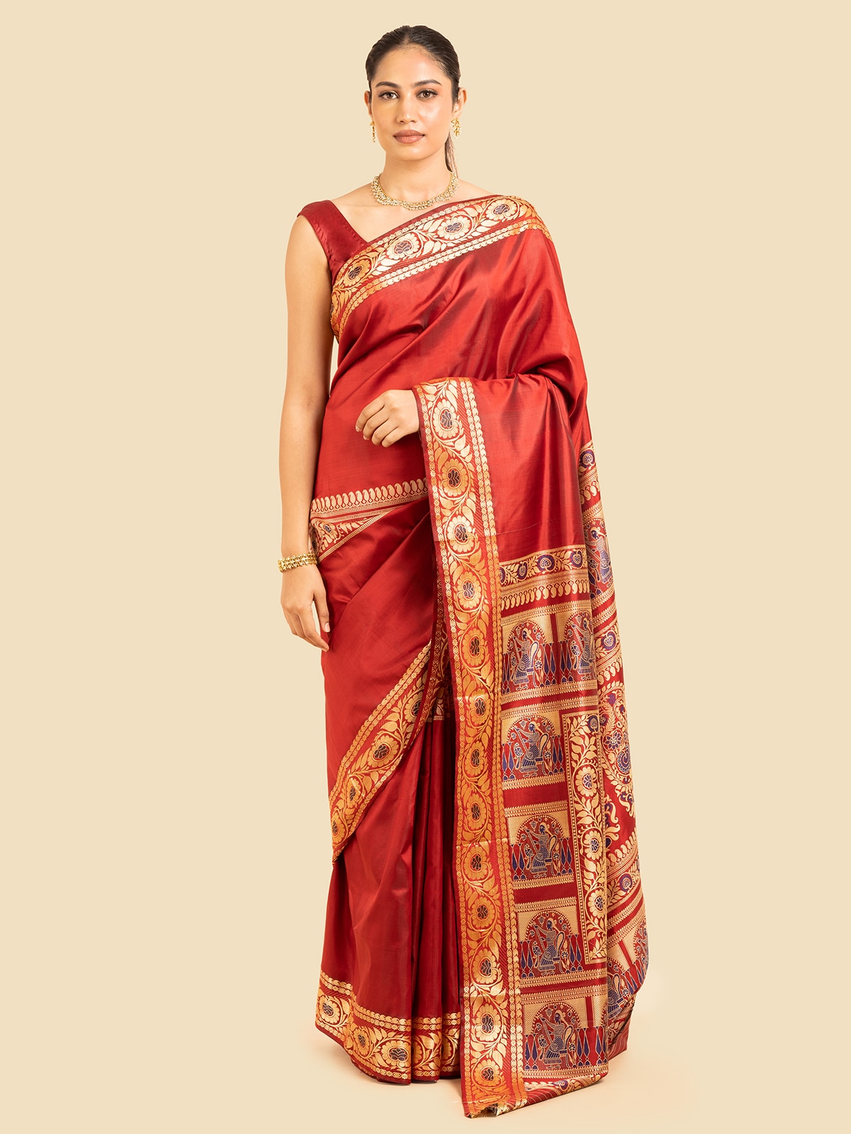 Side view of red mulberry silk Baluchari saree highlighting detailed patterns and silk texture