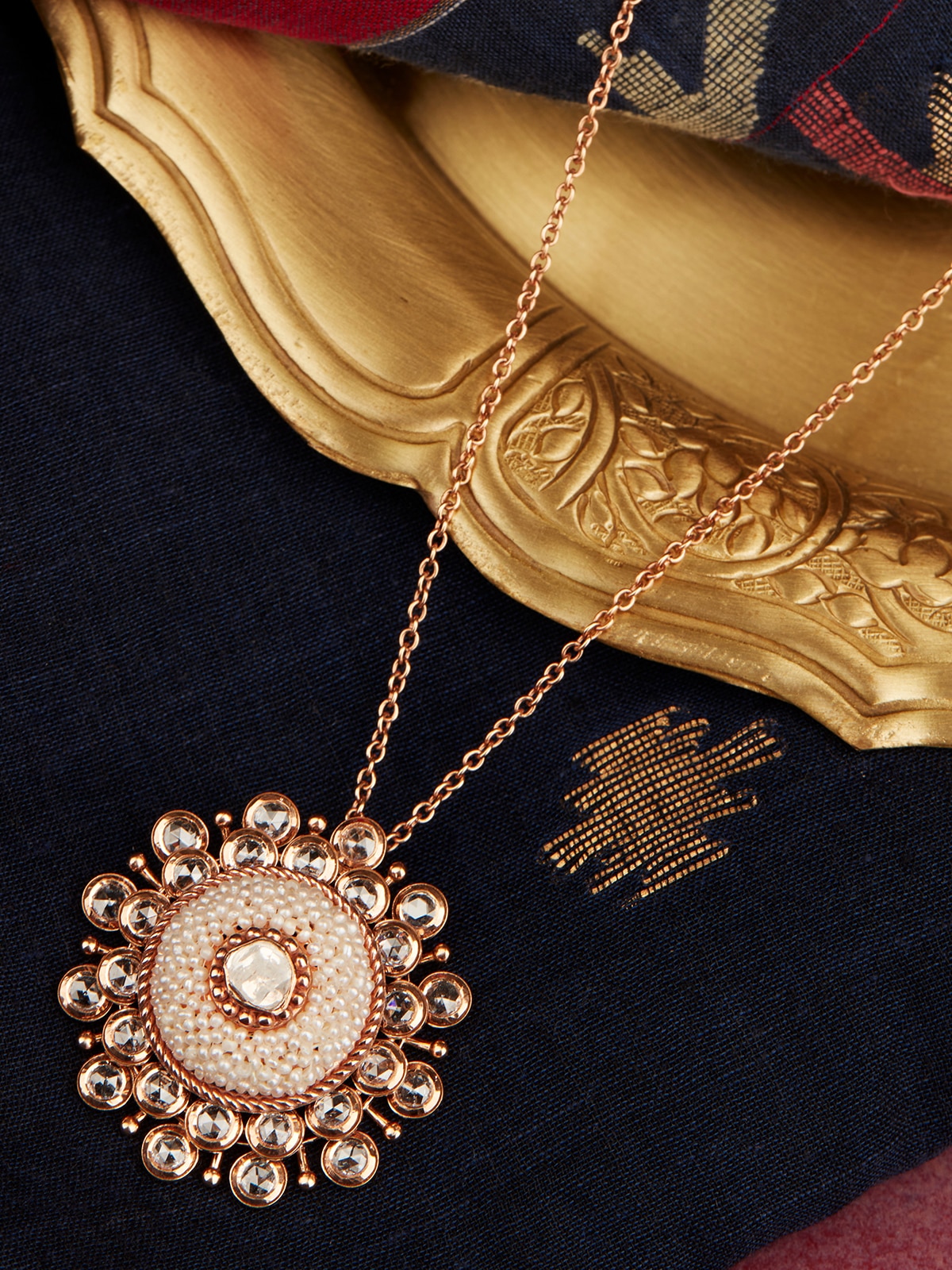 Detailed close-up view of Pearl Pirohi 18 Karat Gold pendant and chain highlighting the pearl and smooth gold craftsmanship.