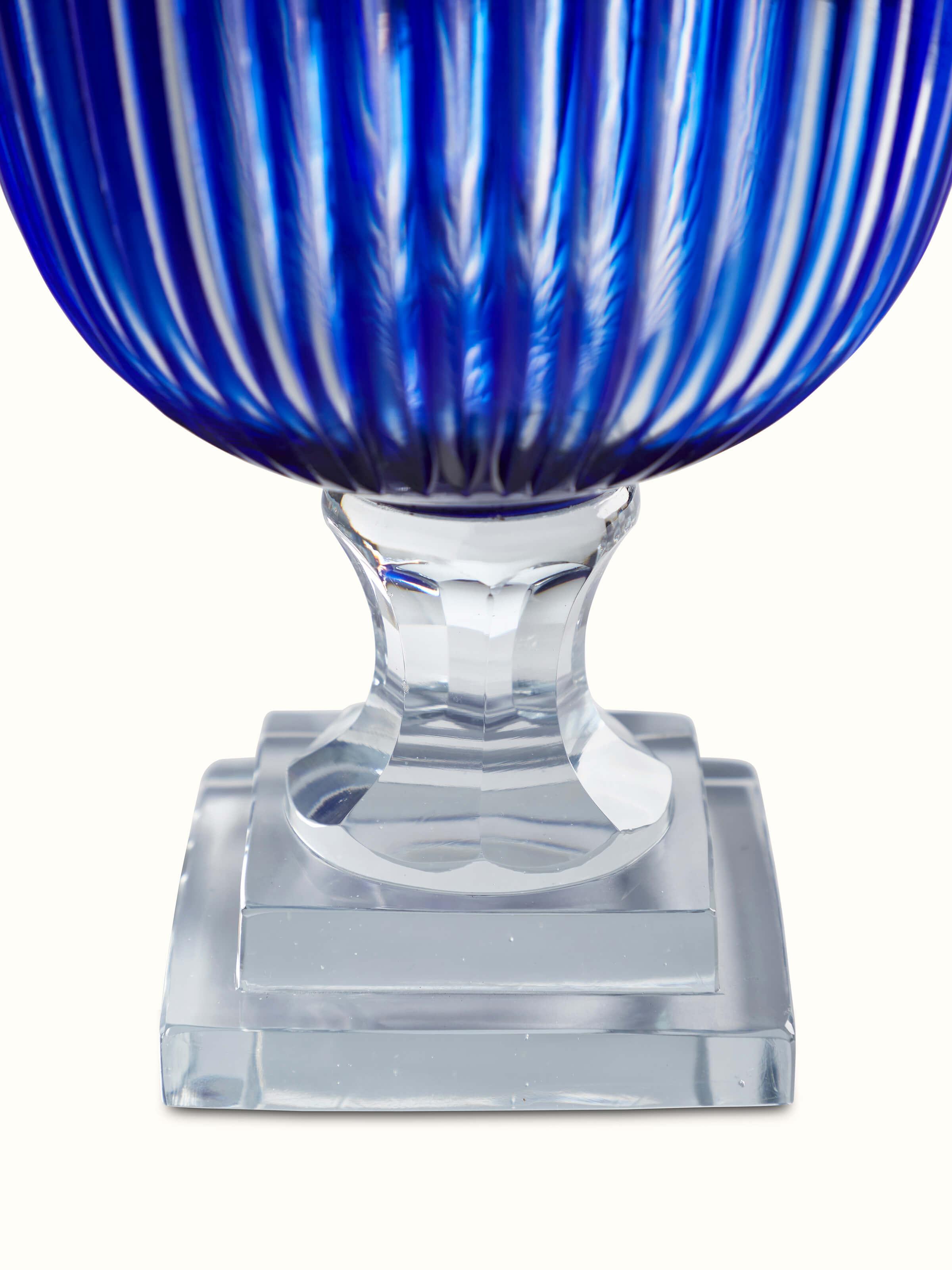 Angled view of Blue Glass Table Vase displaying its modern shape and reflective surface
