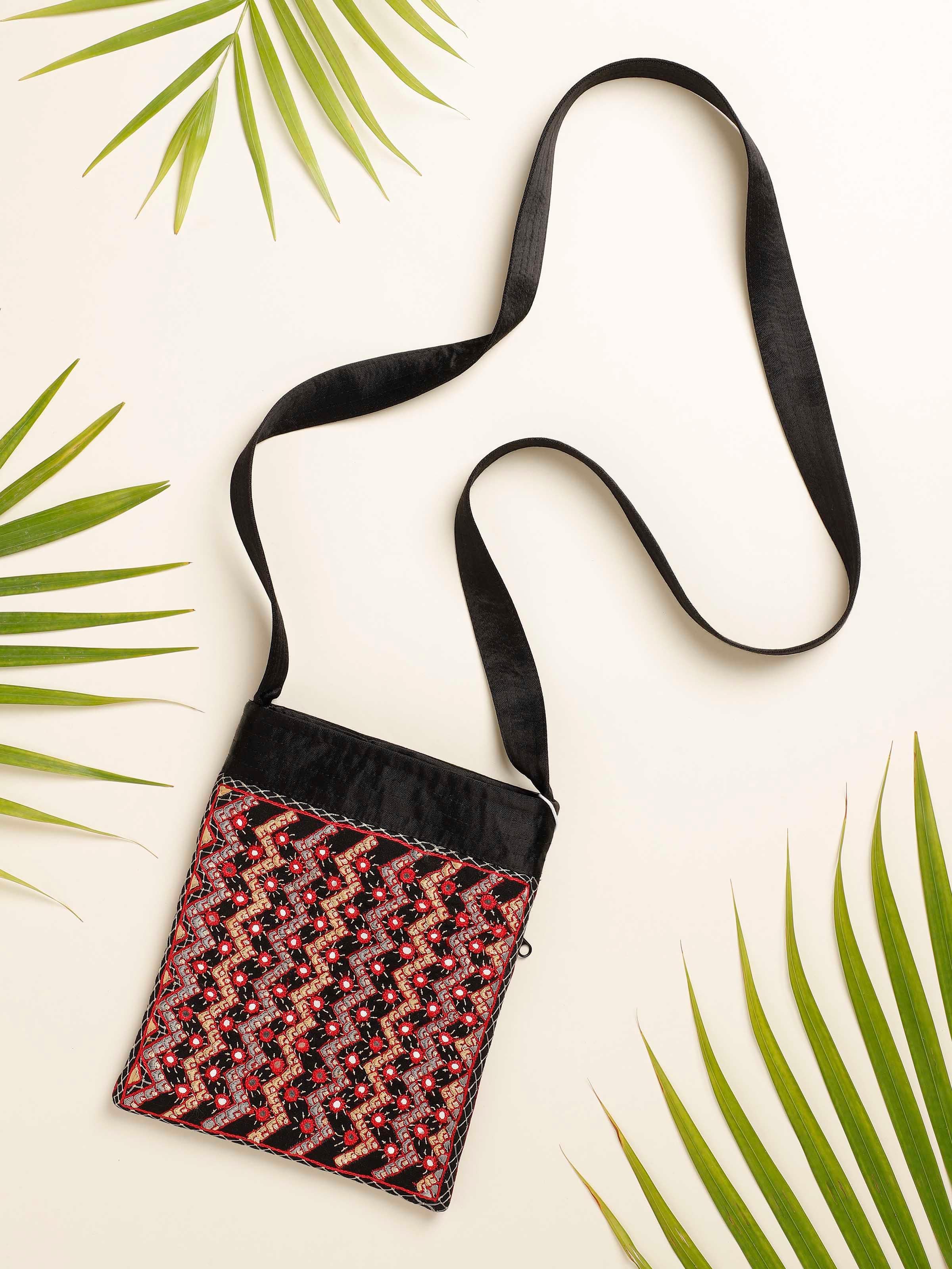 Side view of Kutchi Embroidered Sling Bag highlighting strap and embroidered details.