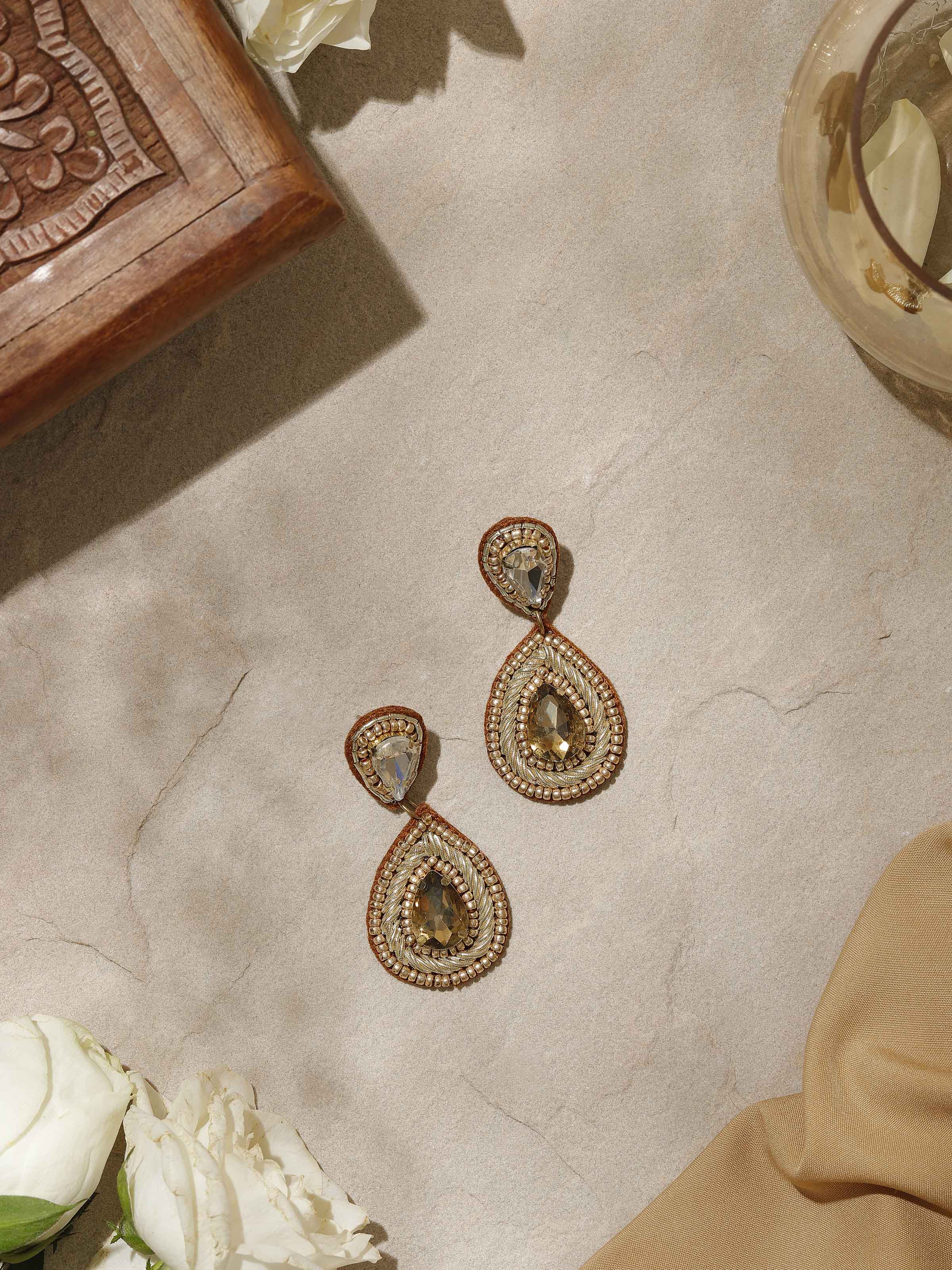 Side view of Handcrafted Drop Earrings showcasing their unique craftsmanship and detailed design