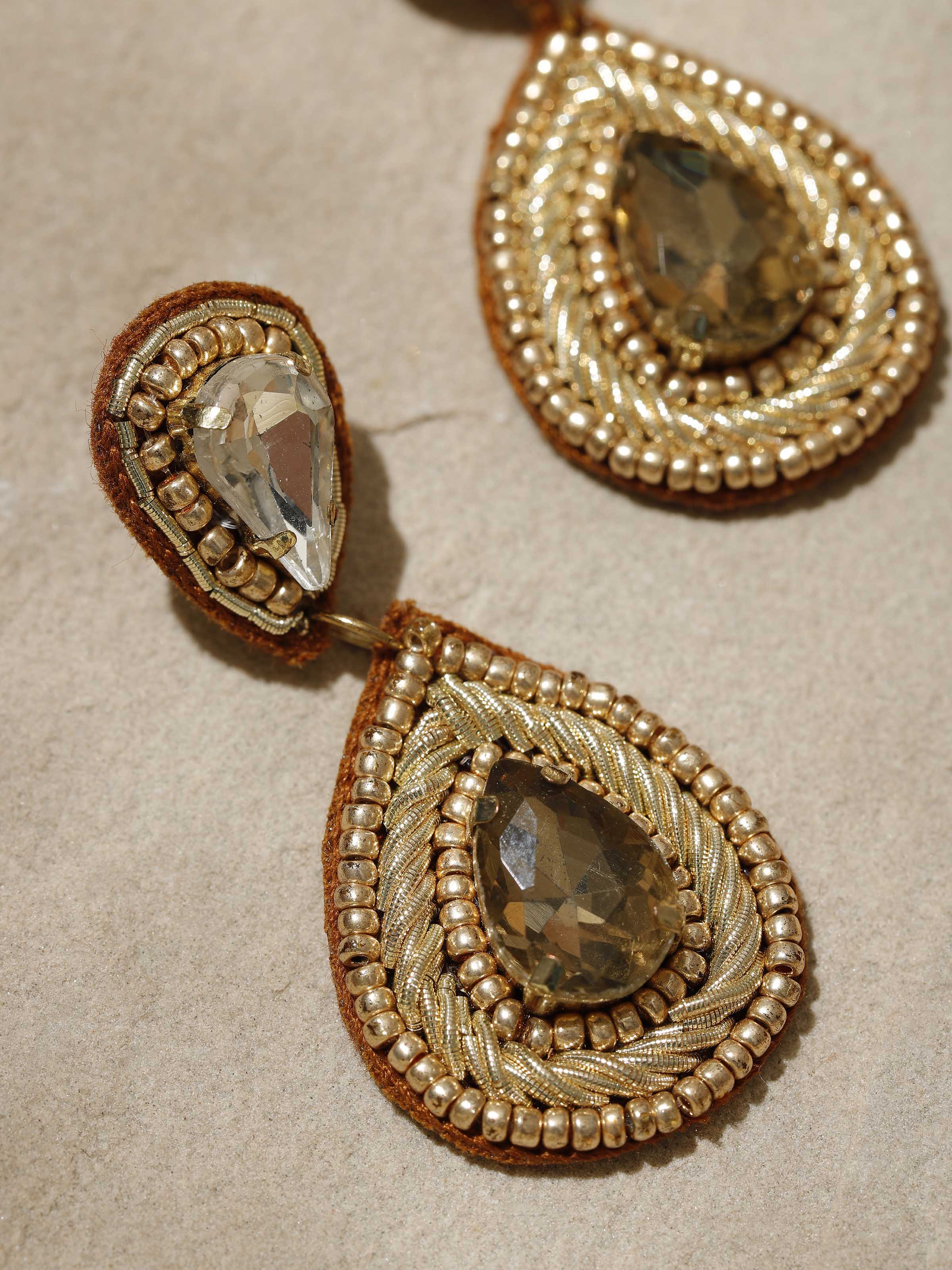 Angled view of Handcrafted Drop Earrings showcasing their elegant drop design and intricate detailing