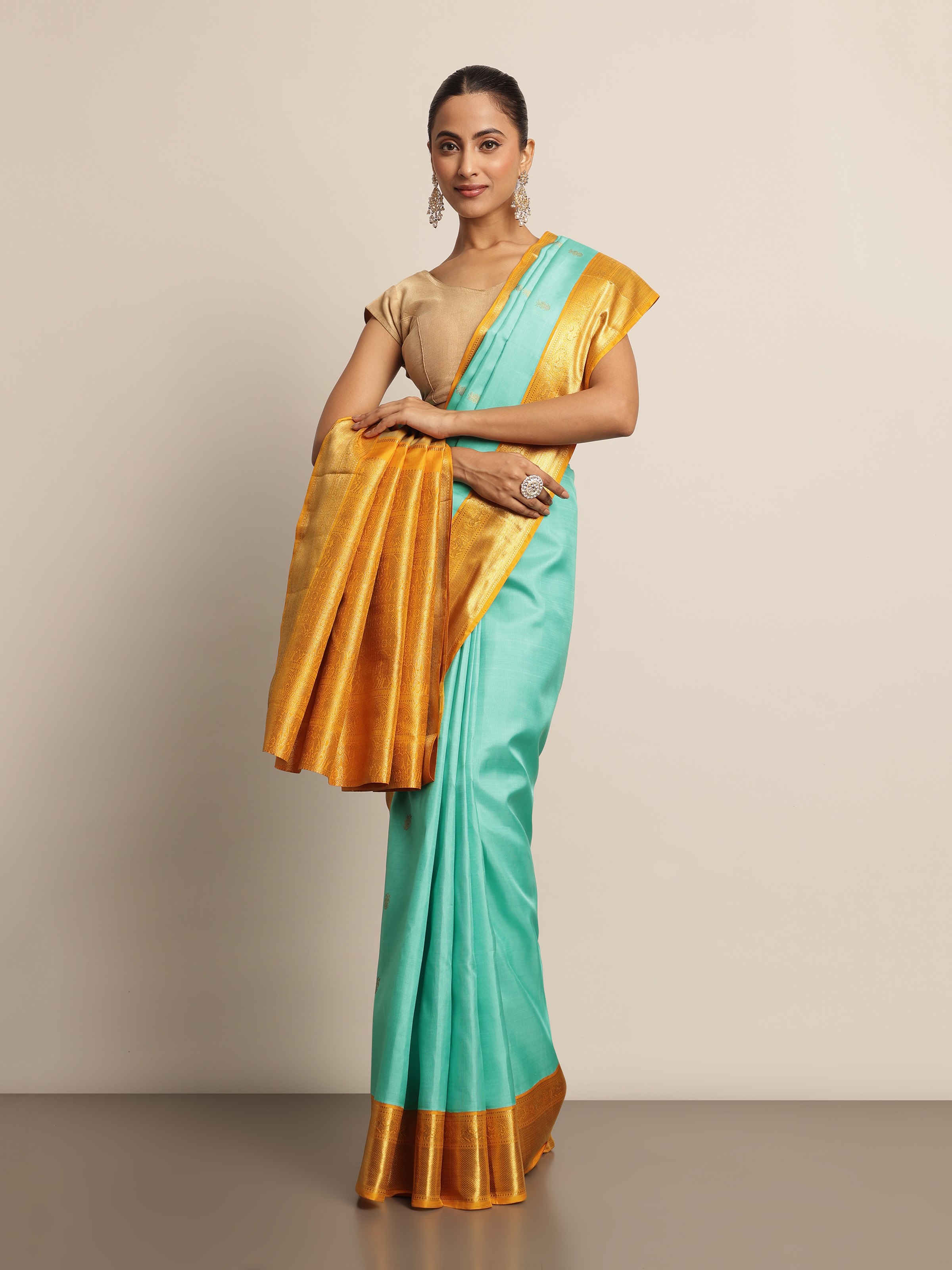 Classic turquoise Kancheepuram silk saree - styled lifestyle image