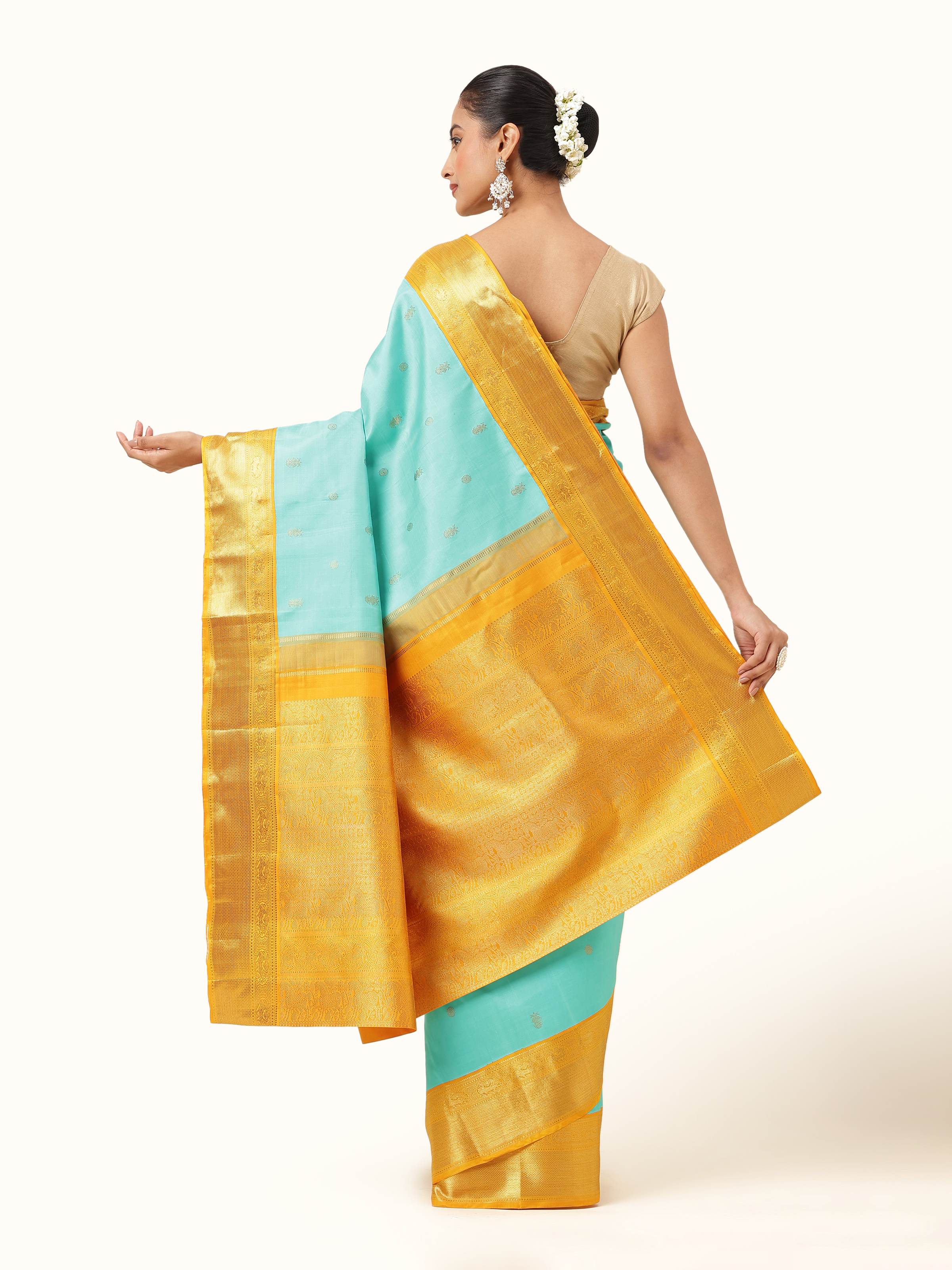 Back view of turquoise Kancheepuram silk saree - traditional wear