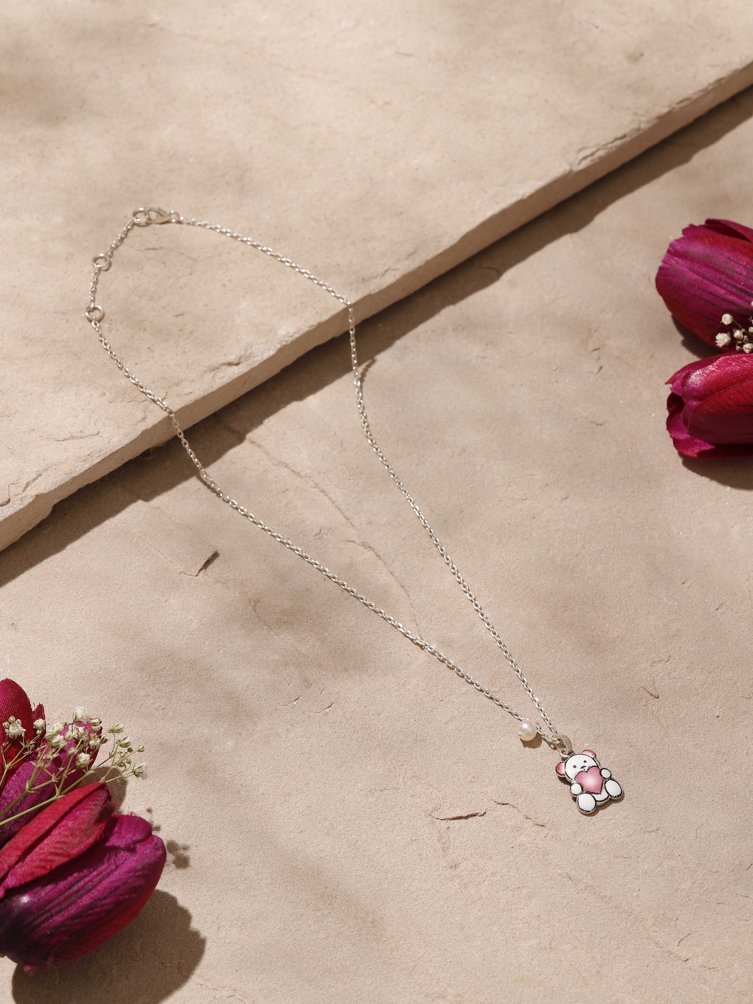 Top angle highlighting craftsmanship of Gulabi Meenakari silver pendant and chain