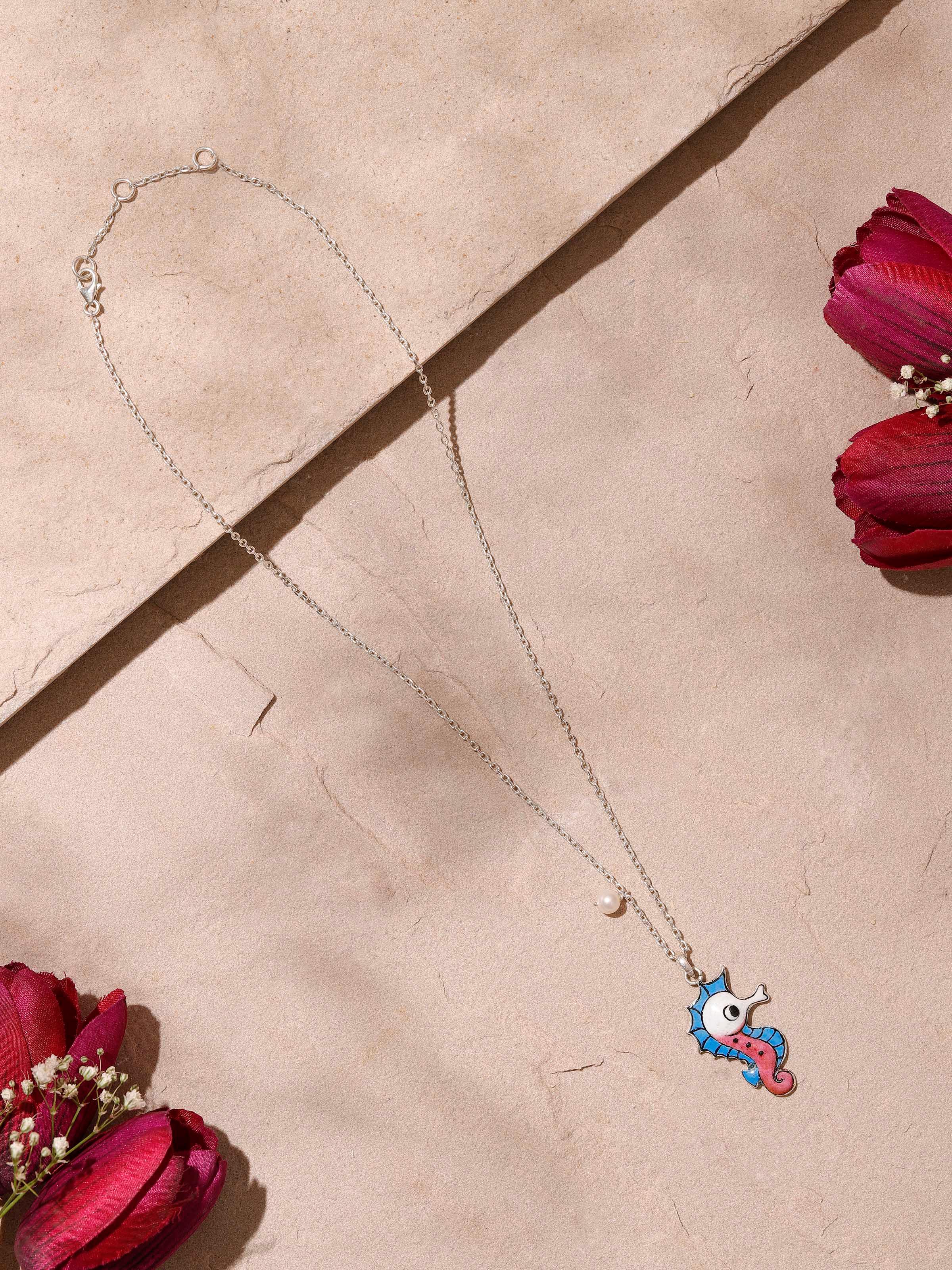 Side view of Gulabi Meenakari Silver Pendant & Chain by Swadesh showcasing intricate meenakari work and delicate silver chain
