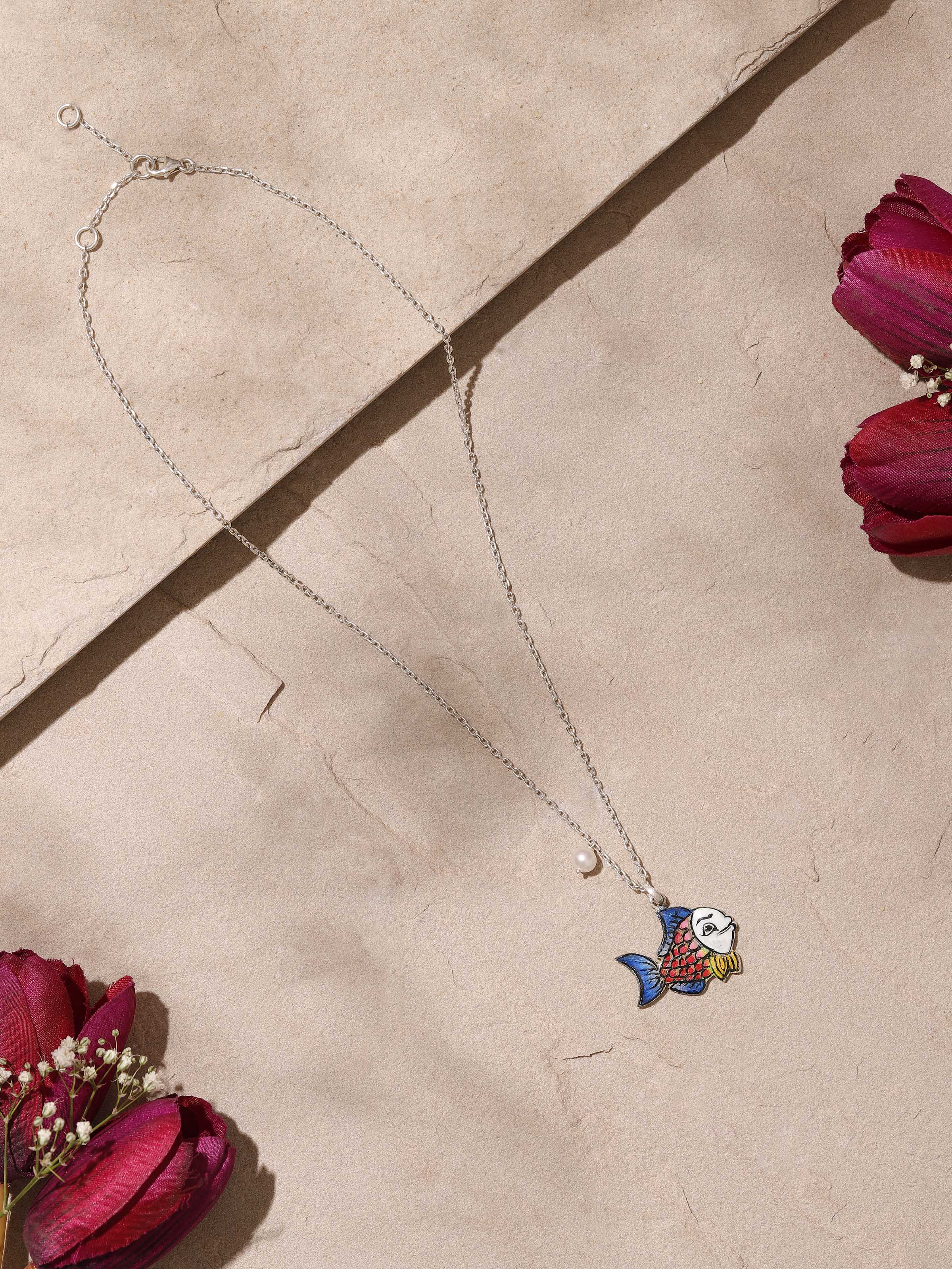 Side view of Gulabi Meenakari silver pendant and chain showcasing floral motifs and elegant craftsmanship