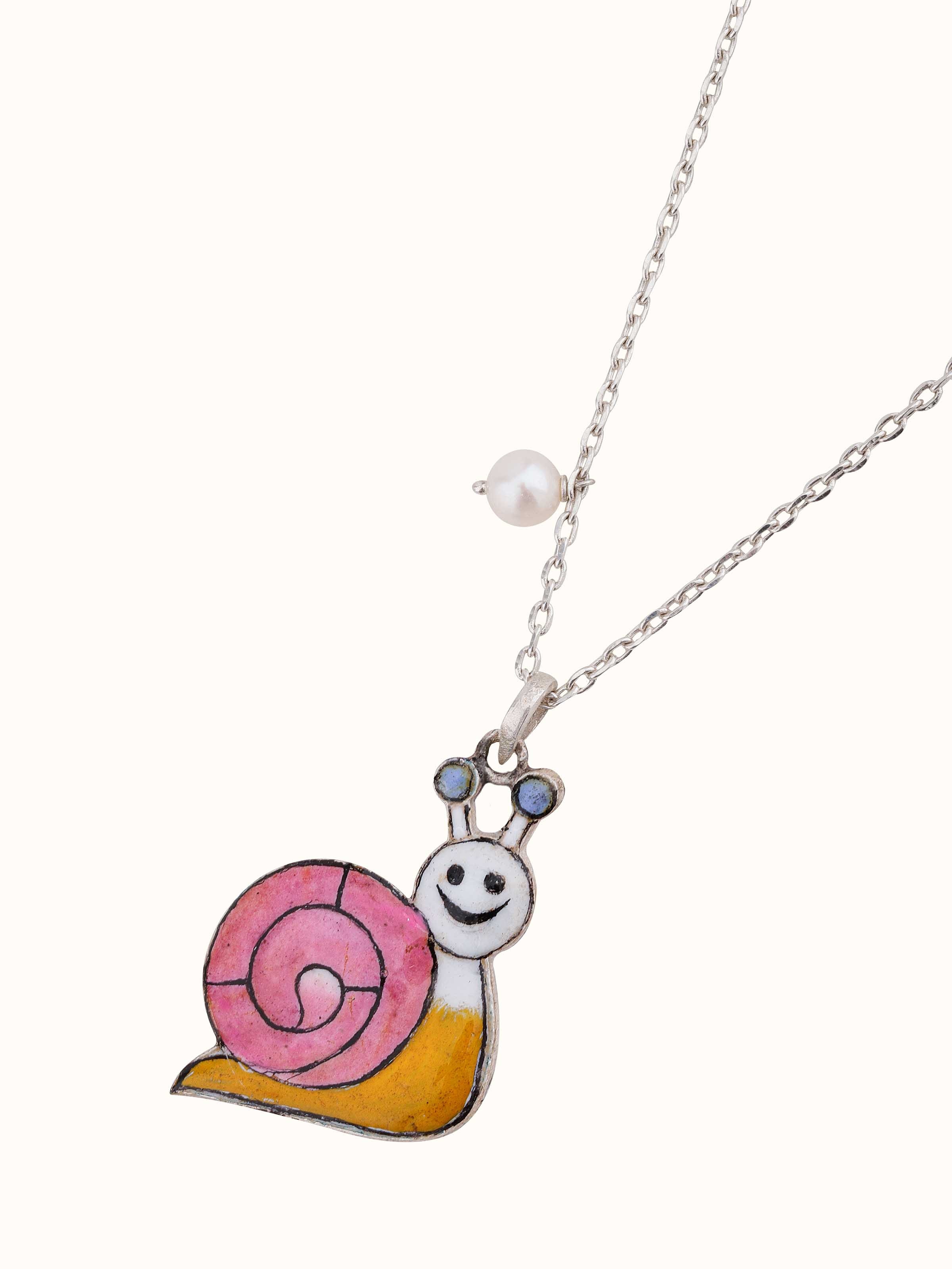 Overhead shot showing the overall design and shape of the meenakari pendant