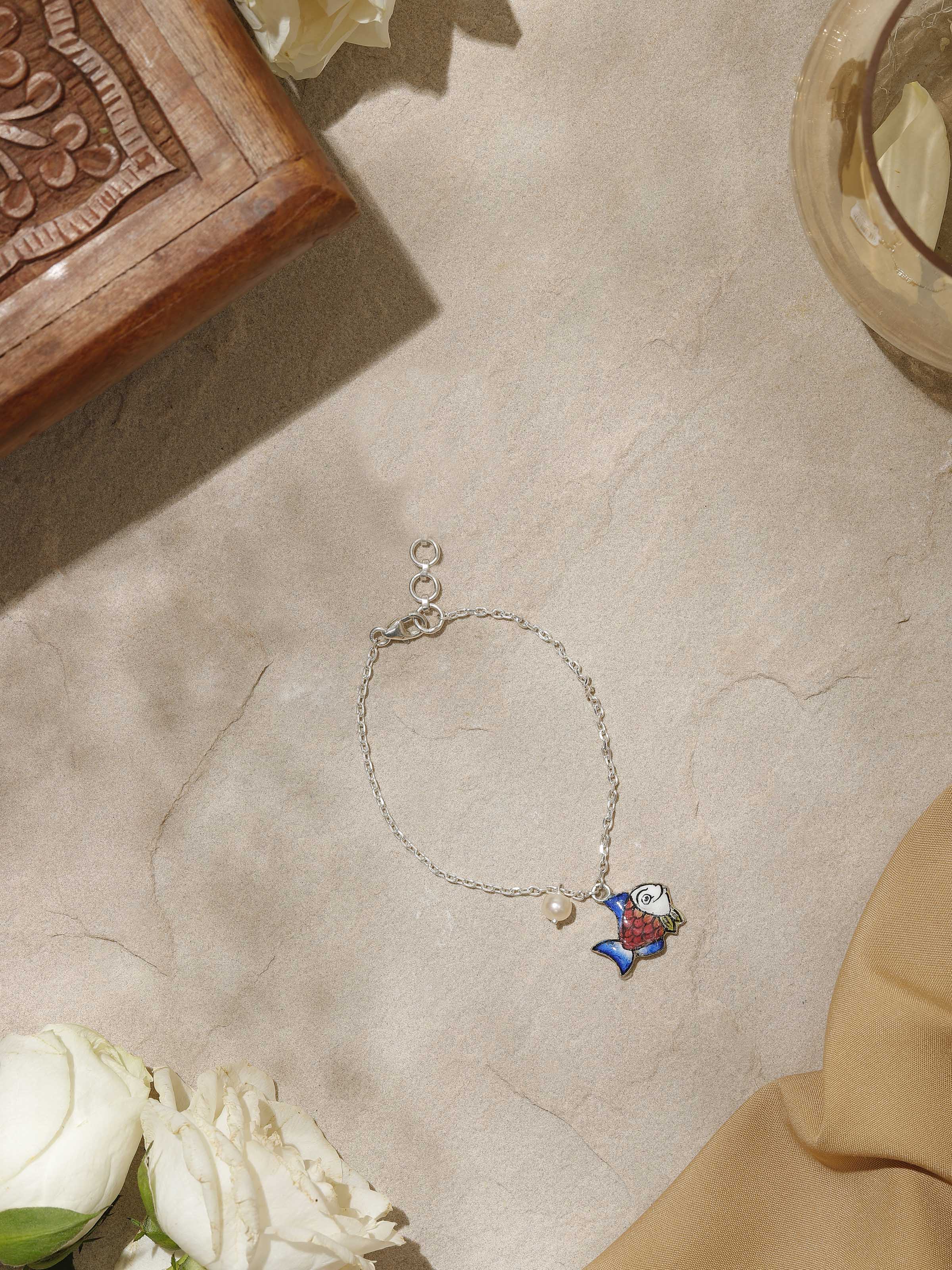 Side view capturing the bracelet’s flexible design and intricate pink Meenakari details