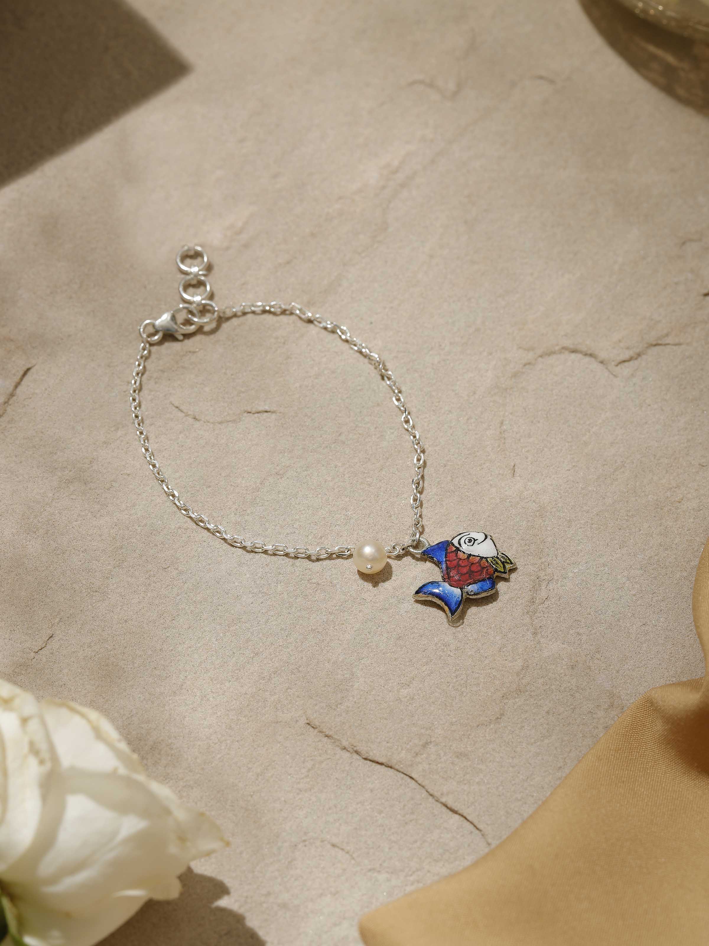 Angled shot highlighting the bracelet’s seamless craftsmanship and delicate silver finish