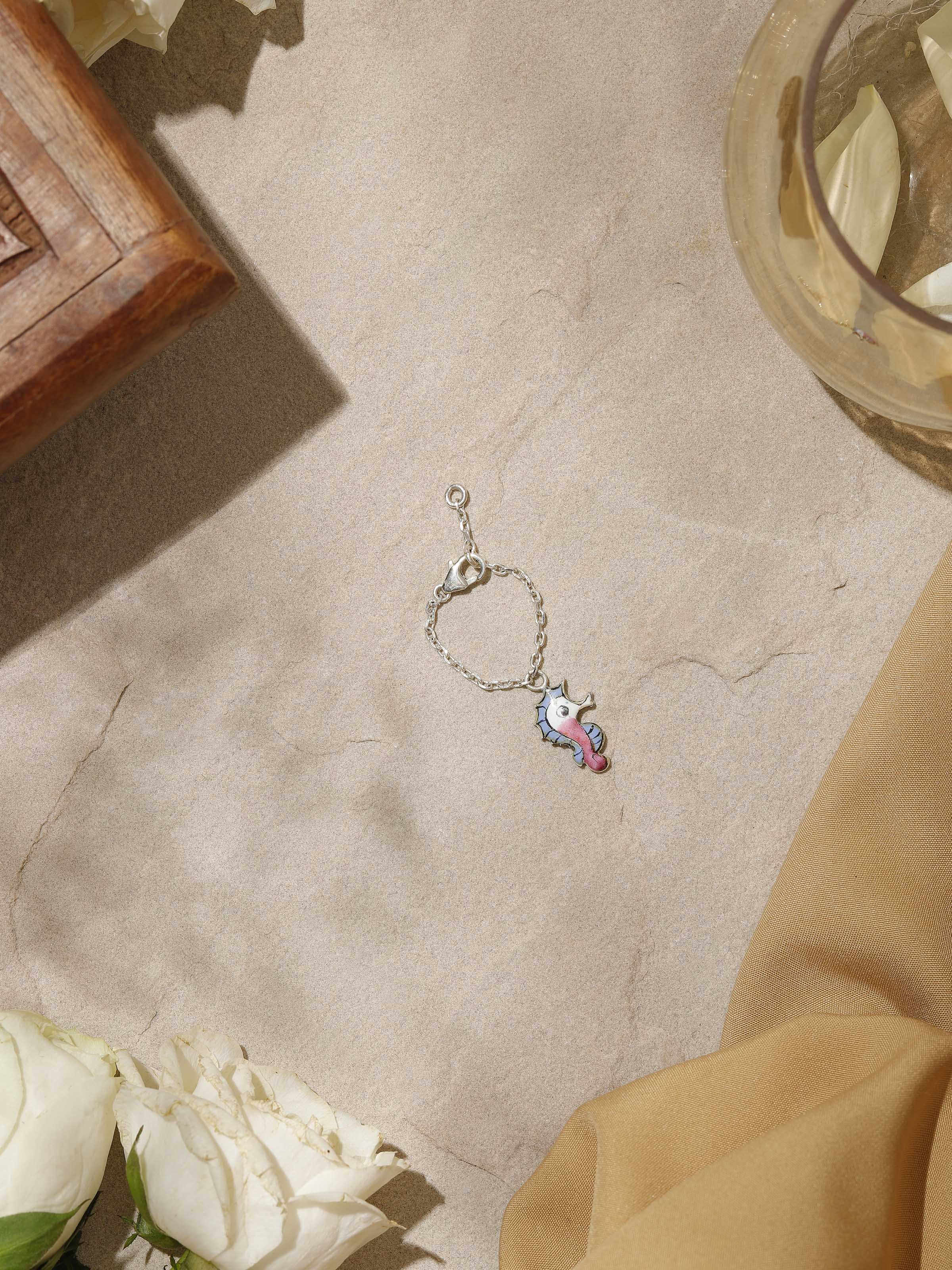 Close-up top view focusing on detailed craftsmanship and vibrant pink meenakari patterns