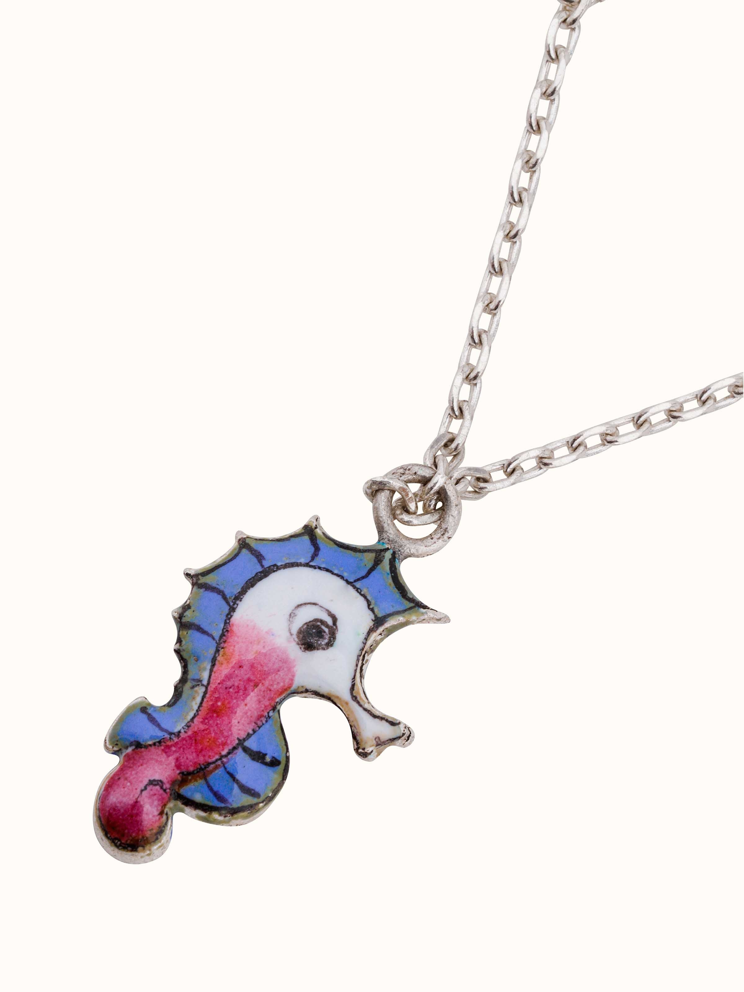 Overhead shot displaying the shape and ornamental design of the silver watch charm