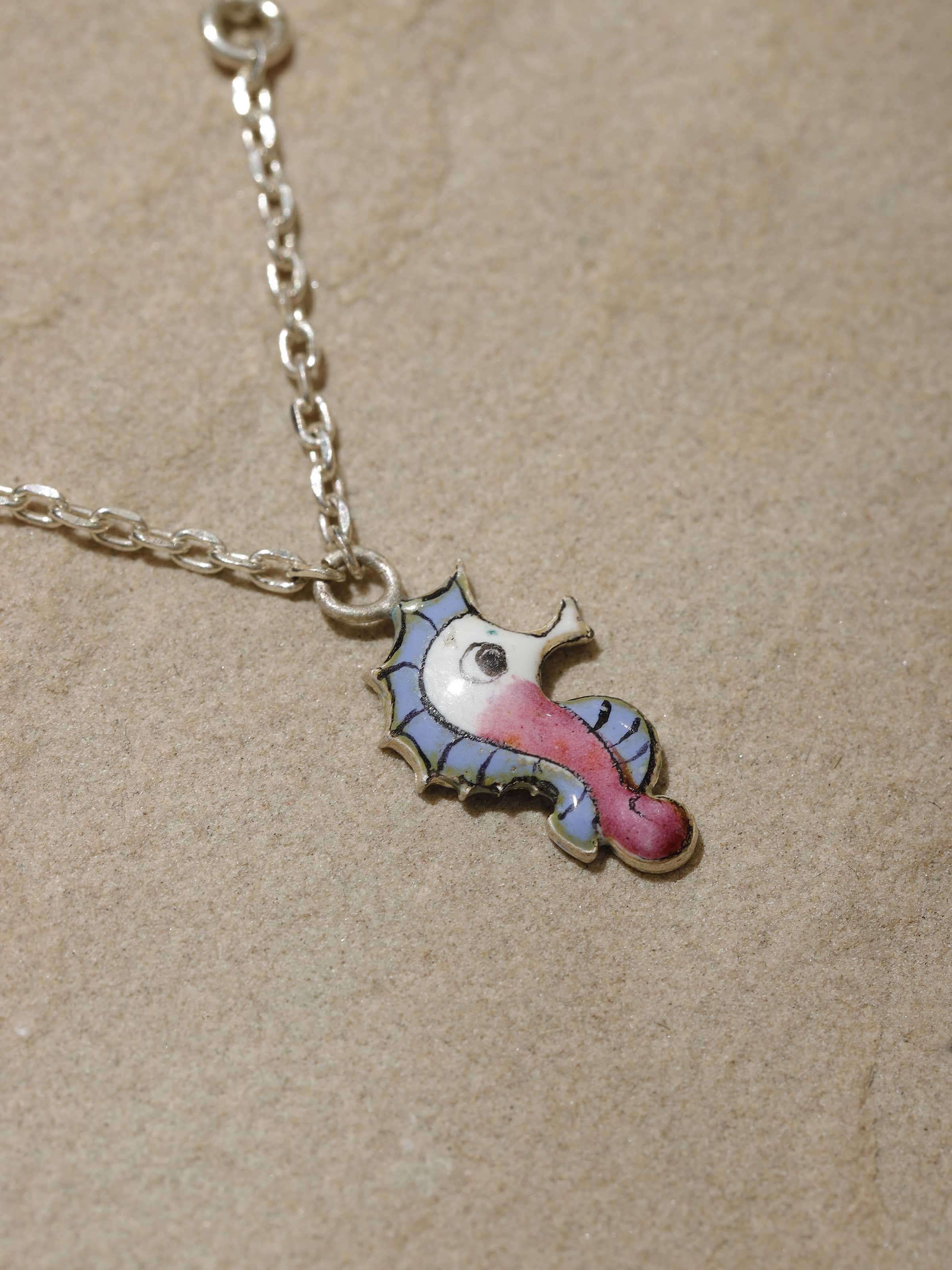 Detailed side profile emphasizing the artistry and polished finish of the Gulabi Meenakari charm