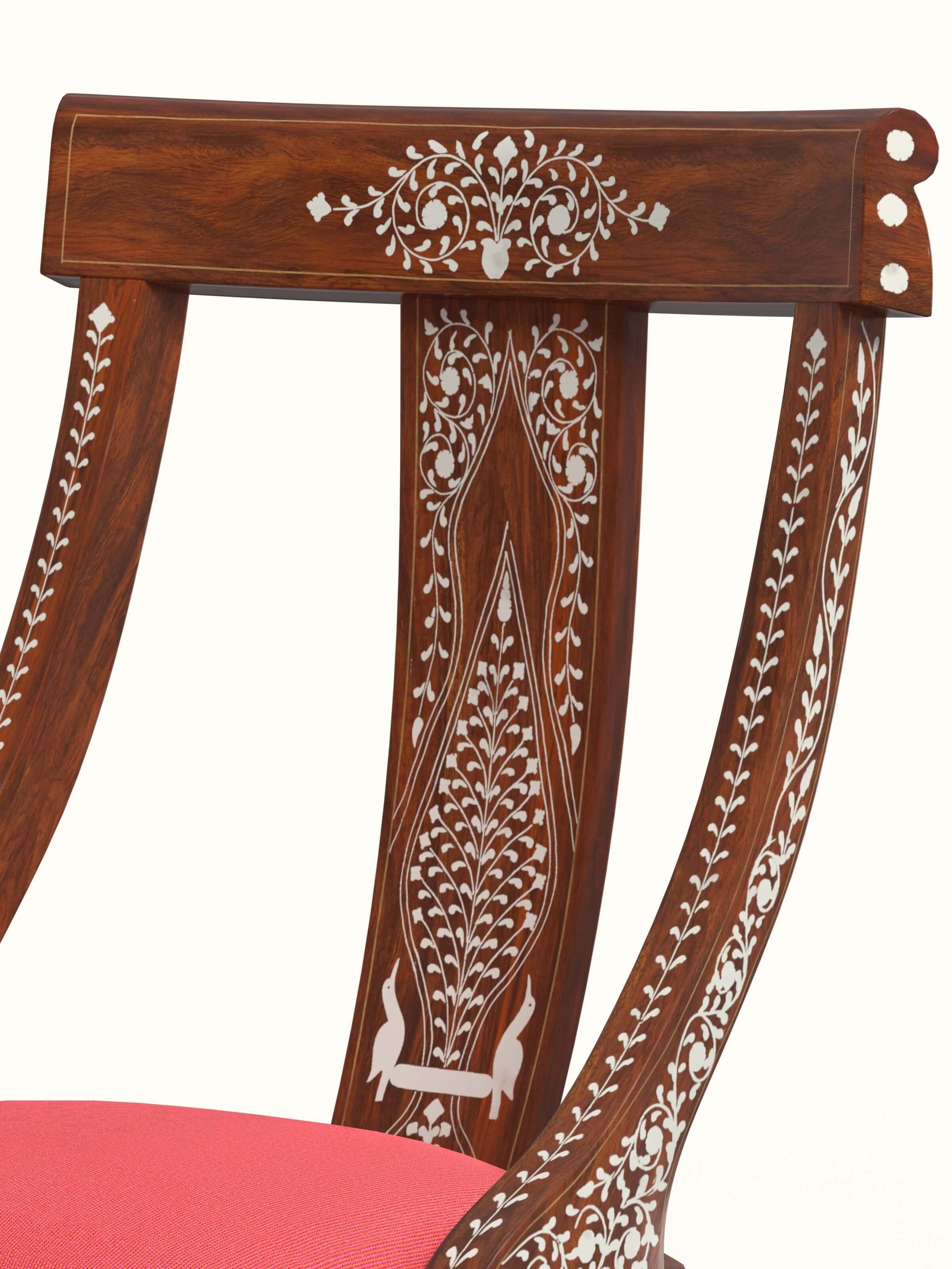 Angled view of the red woven fabric sheesham wood bone inlay dining chair, capturing the elegance and style of the piece