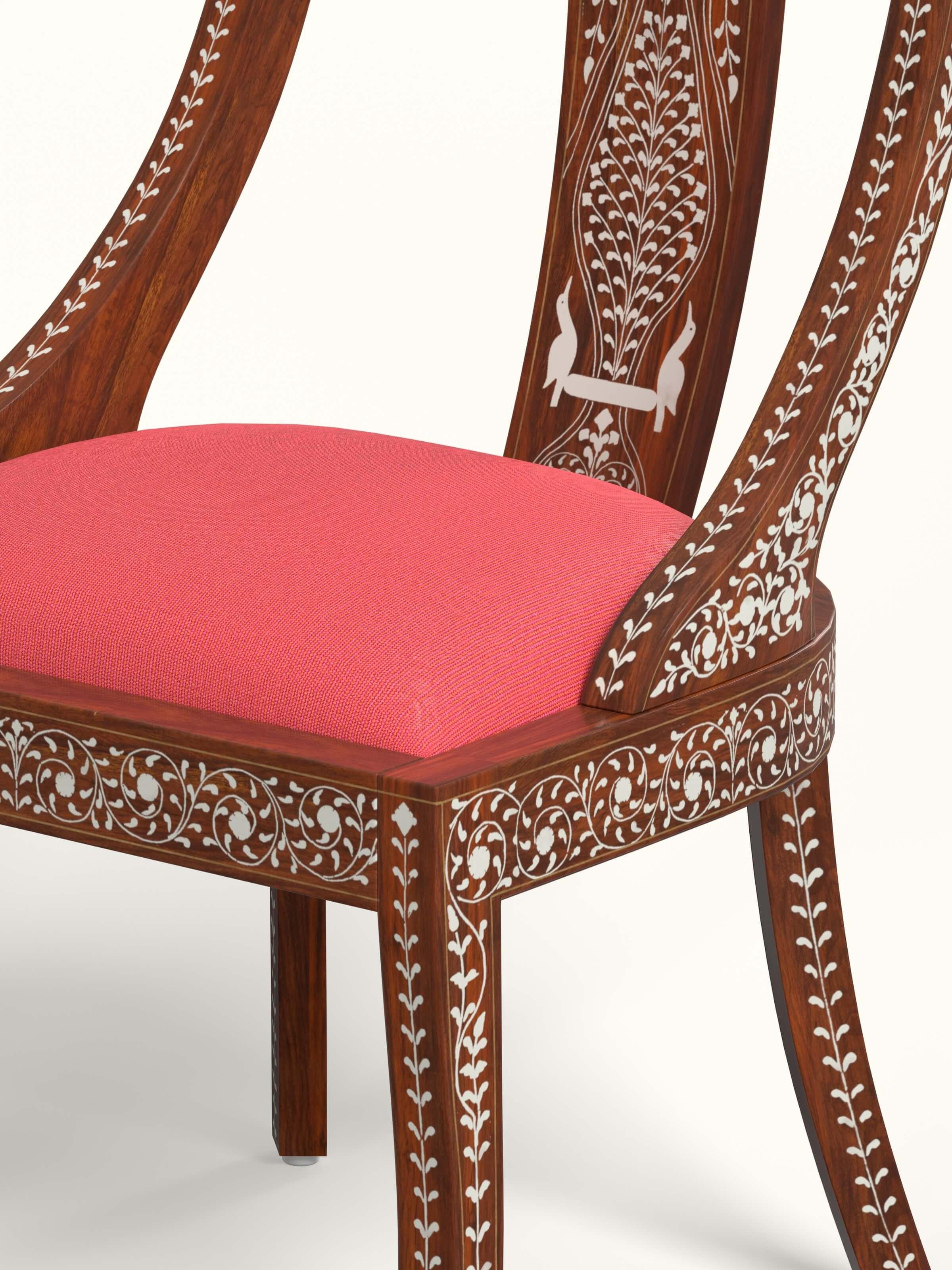 Rear view of the red woven fabric sheesham wood bone inlay dining chair, showing the structural design and craftsmanship