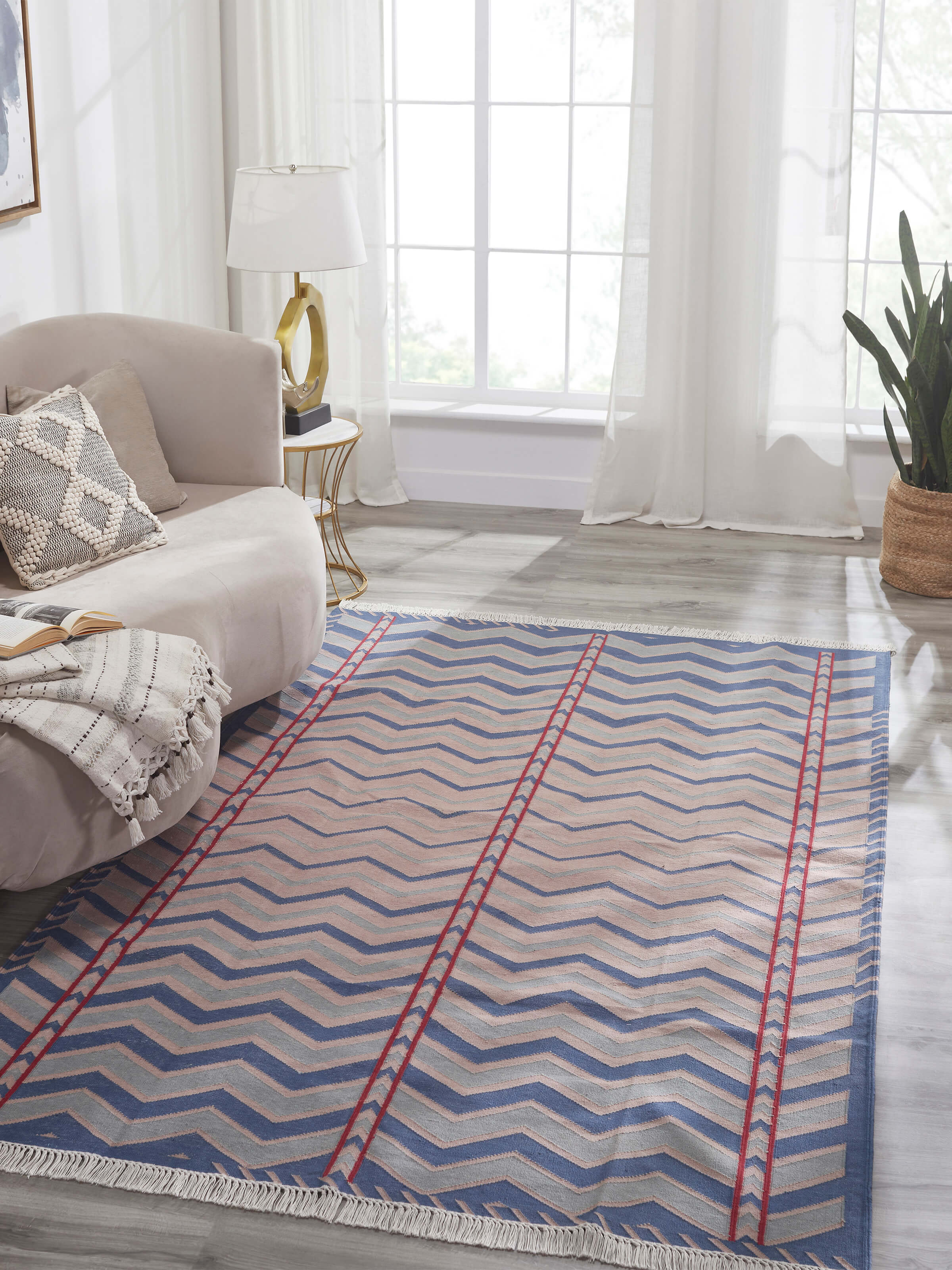 Side view of Geo chevron gradation blue beige lawan cotton panja dhurrie highlighting the fabric texture and pattern.