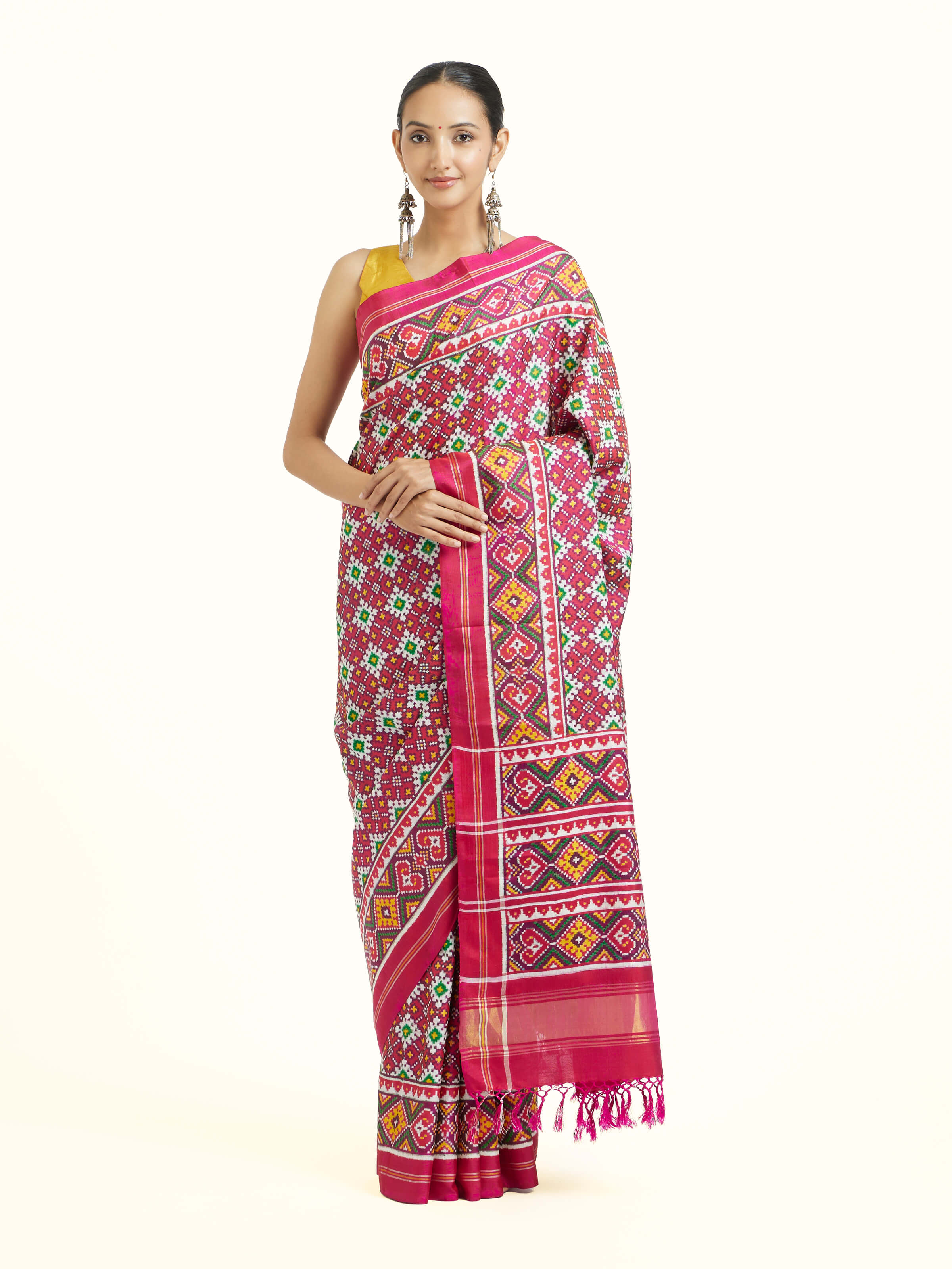 Front view of pink mulberry silk Patan Patola saree with traditional double ikat patterns