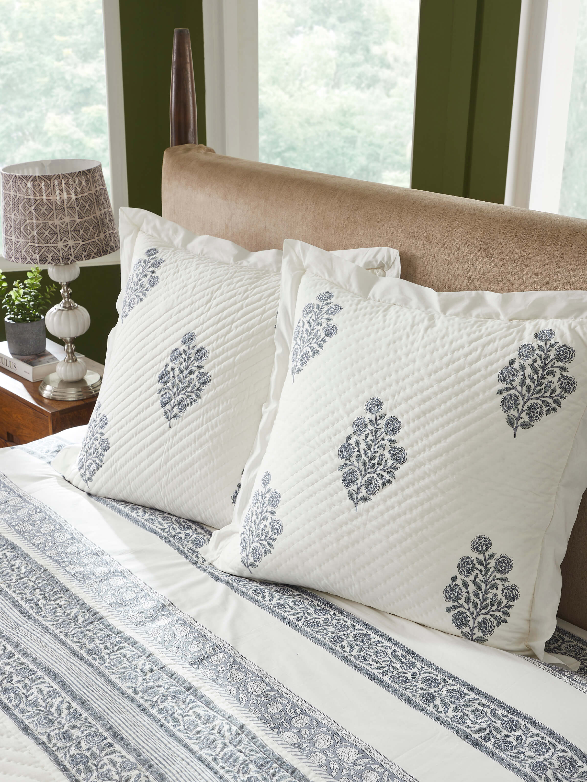 Lifestyle image showing the Saha Grey Buta Stripe Cushion Covers on a sofa setting