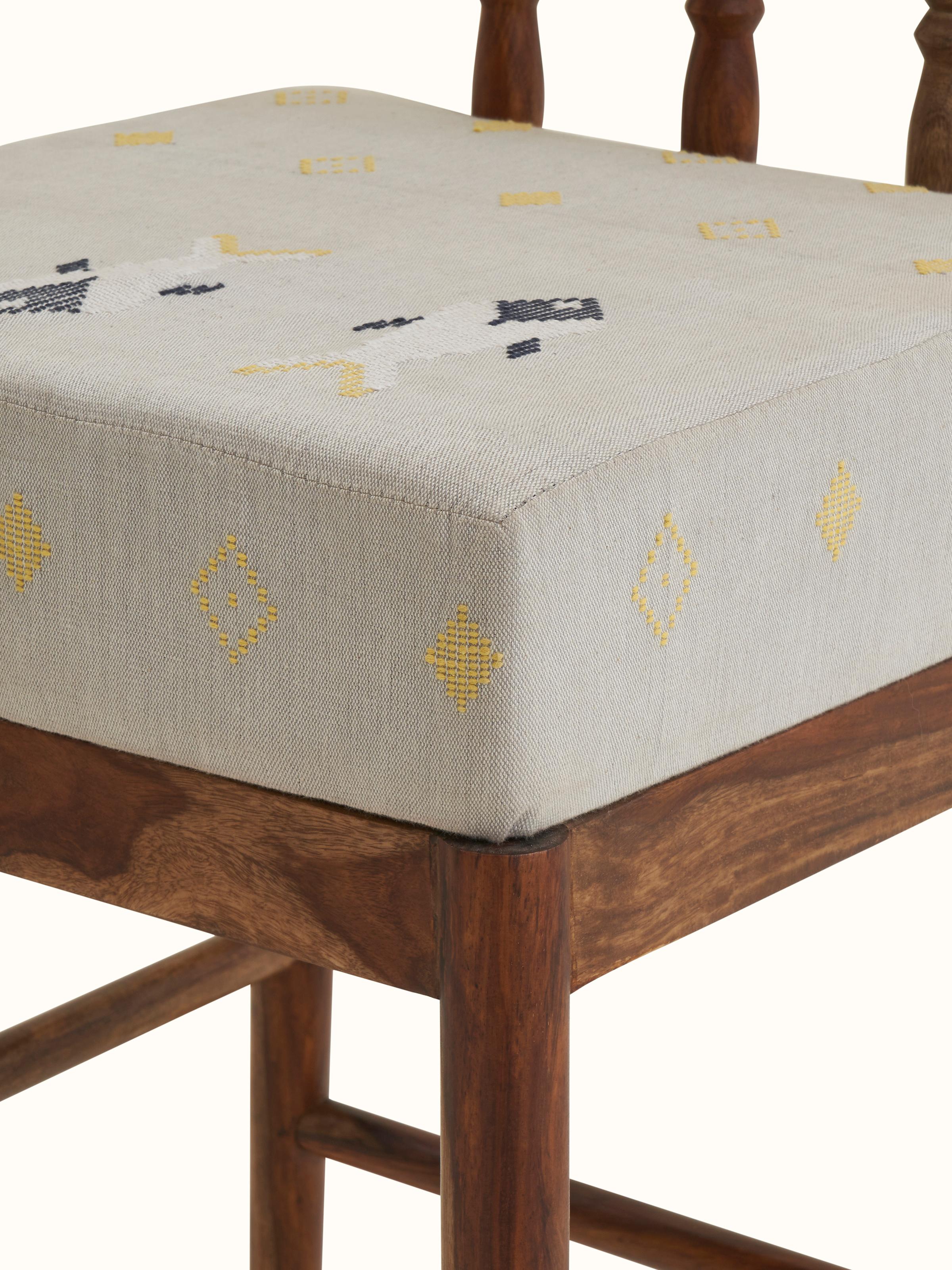 Close-up of Upholstered Sheesham Wood Bawan Buti Bar Stool highlighting intricate patterns
