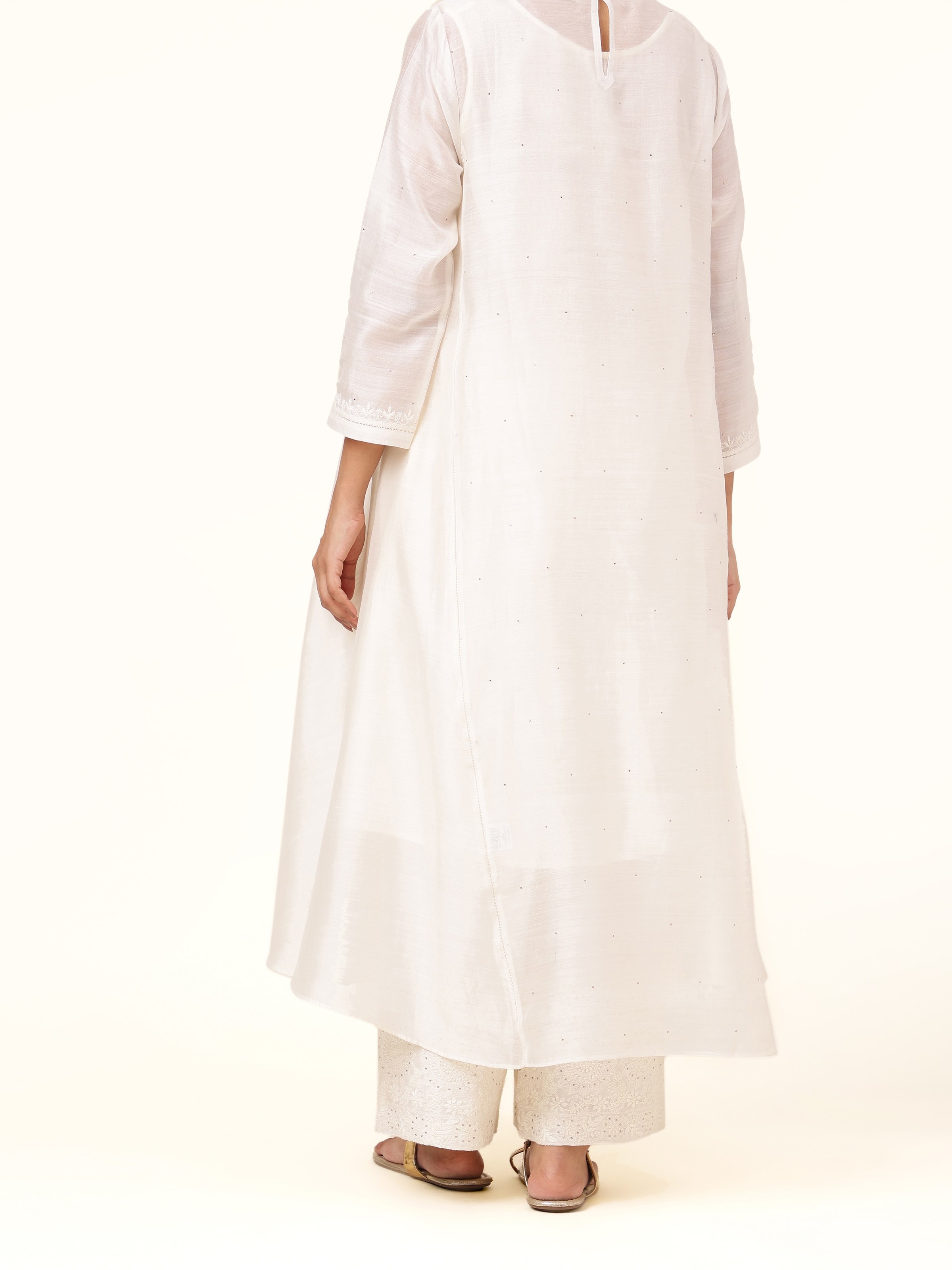 Back view of off-white cotton silk Chikankari palazzo featuring subtle detailing and comfortable fit