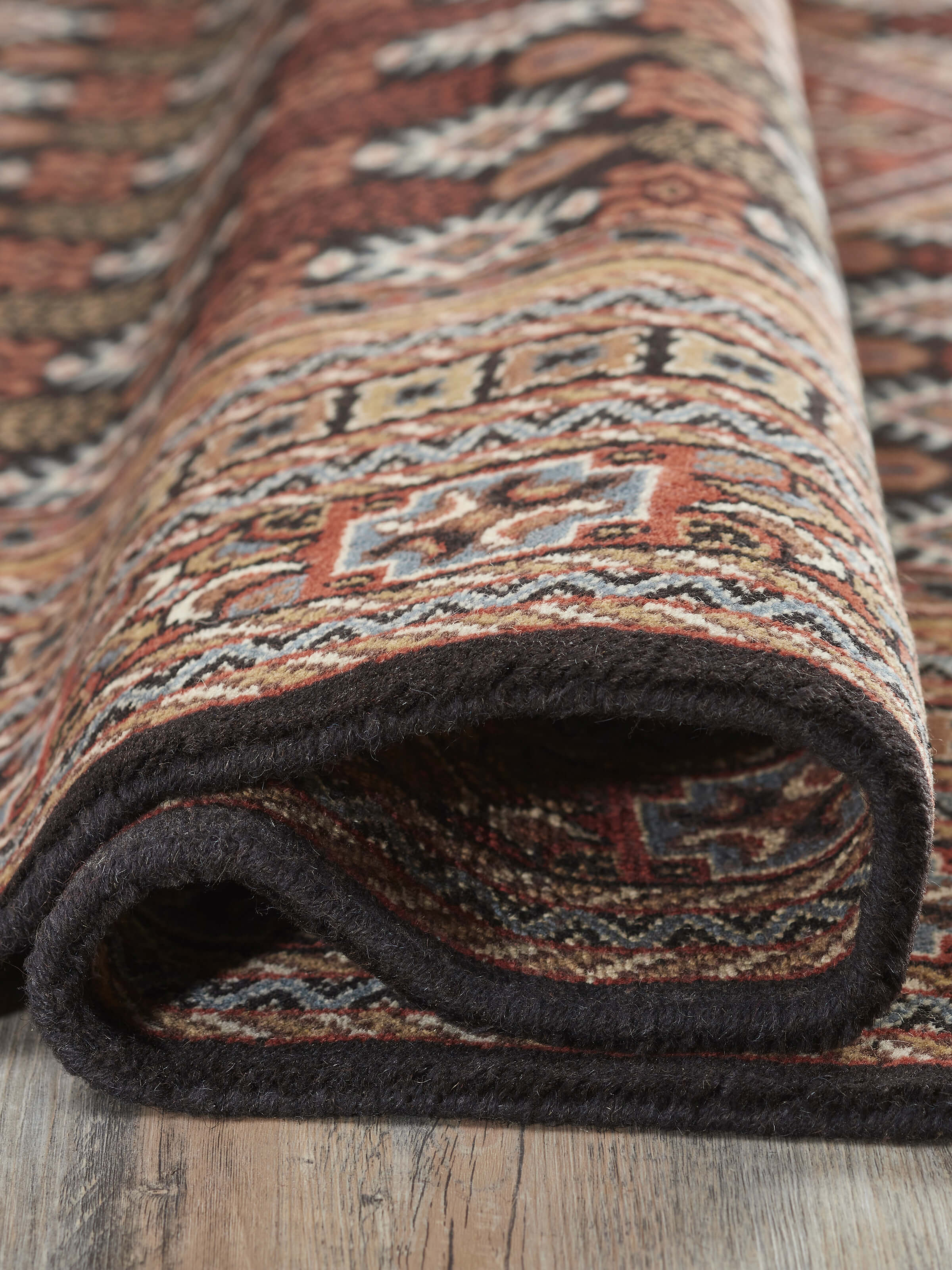 Back view showing the neat hand-knotted work and quality of the wool material