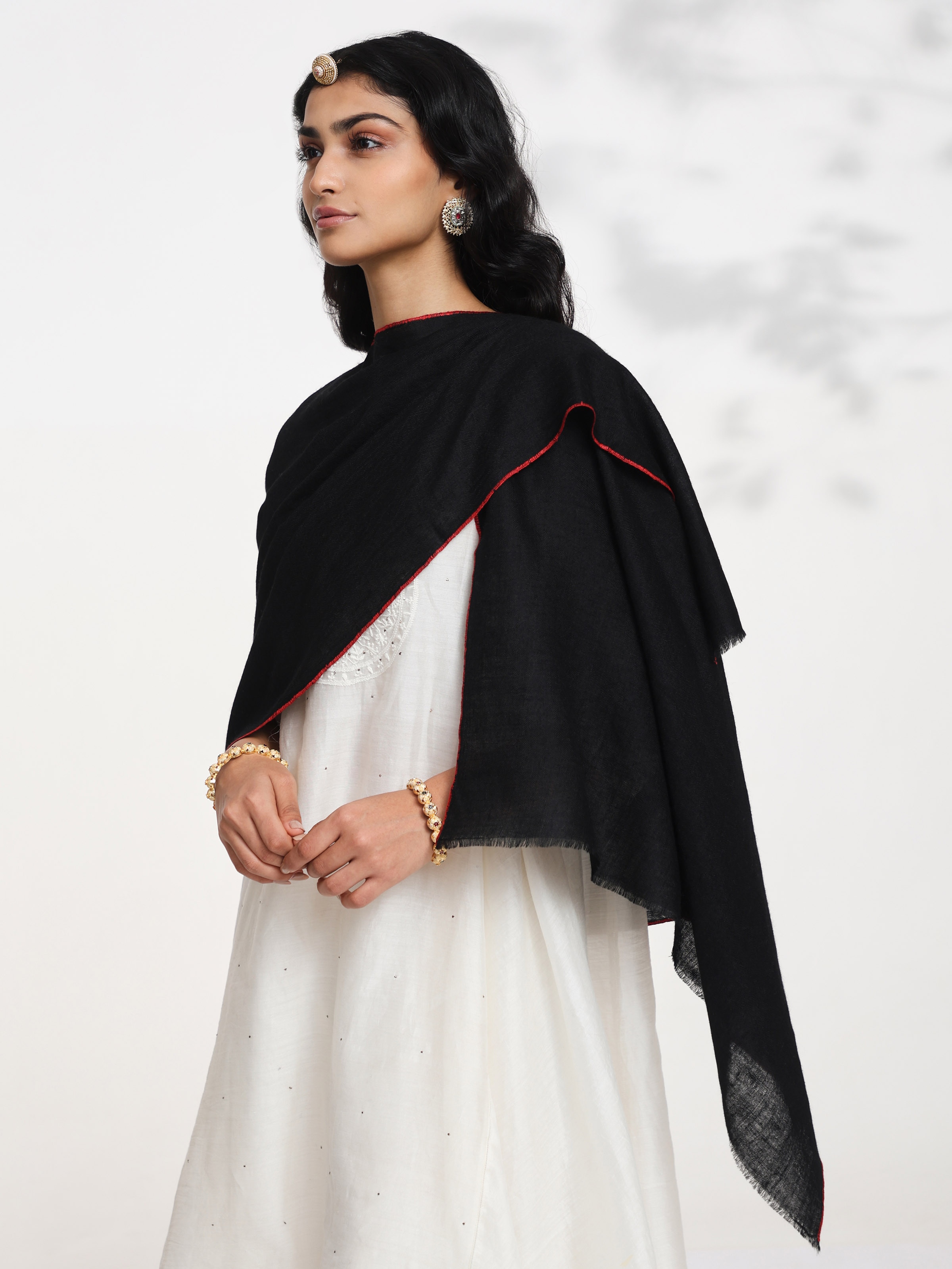 Angled view of black cashmere kaaj embroidered handwoven stole emphasizing intricate kaaj work